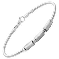 Bracciale a stazione con cavo in oro bianco 18 carati