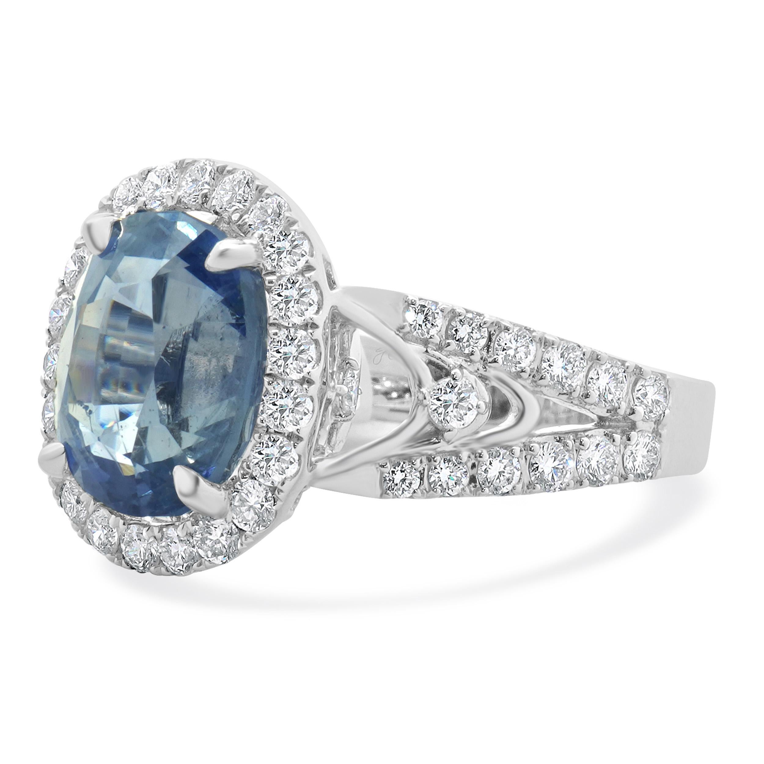 Designer: custom
Material: 18K white gold
Diamond: round brilliant cut = 0.98cttw
Color: G
Clarity: VS1-2
Sapphire: 1 oval cut = 5.77ct
Ring Size: 6.5 (please allow two extra shipping days for sizing requests)
Weight: 7.28 grams
