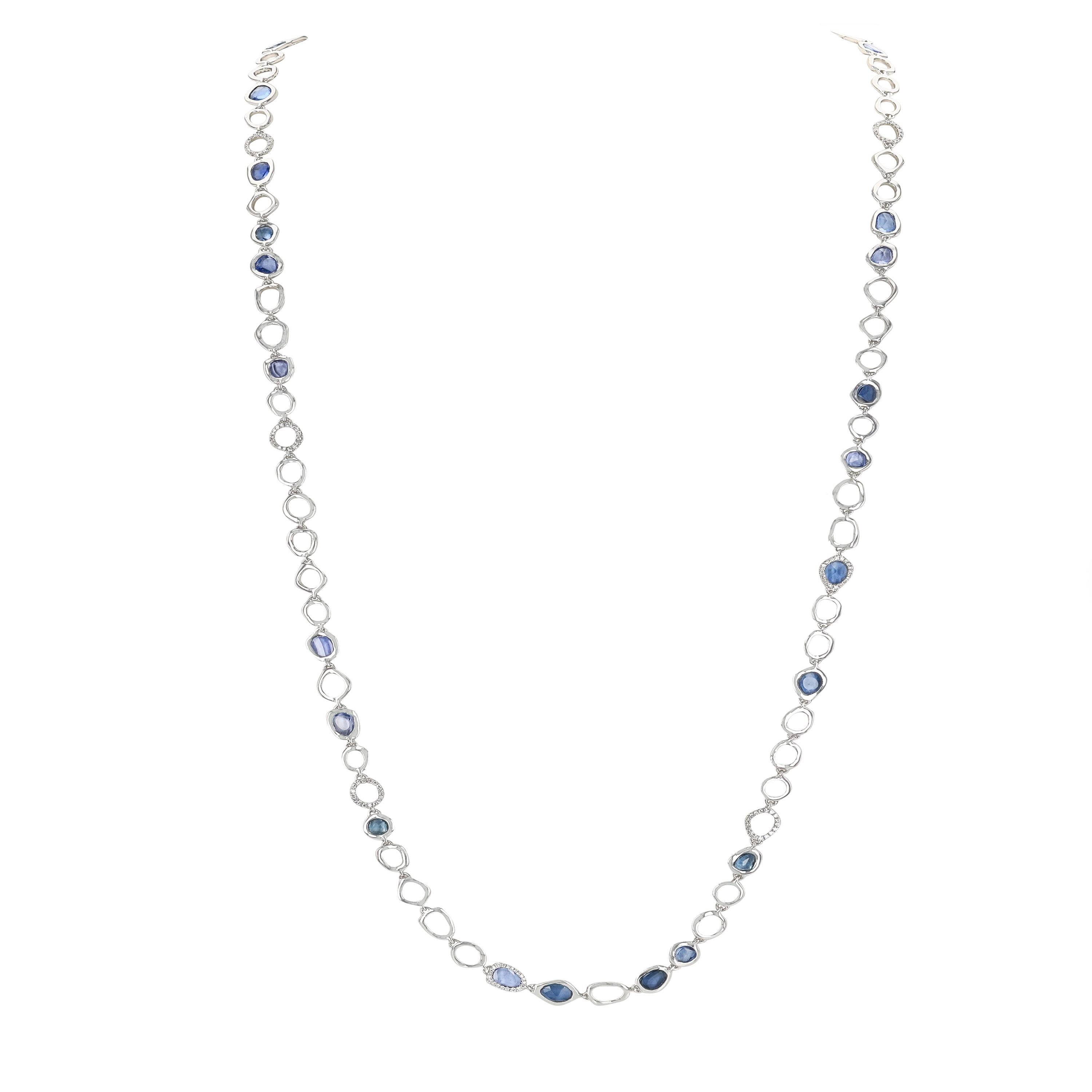 Perfectly balanced with blue sapphires and white gold, this white gold long chain is a stylish design that is playful yet utterly opulent. A celebration of diamonds is woven together to create this stunning and completely classic gold chain. Brought
