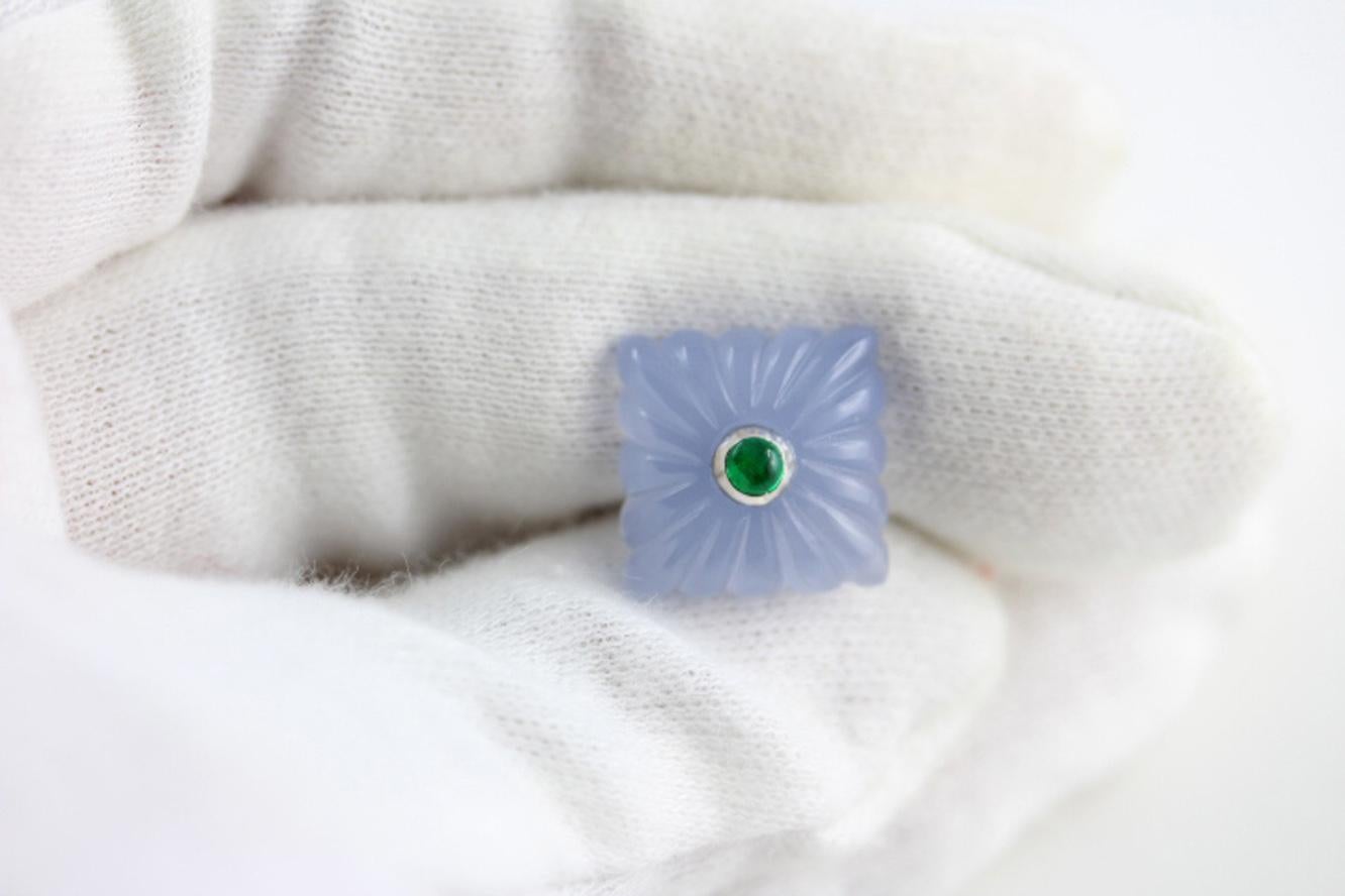 This striking and incredible pair of cufflinks is entirely made of chalcedony, whose pearly white shade highlights the beautiful and classic “fesonato” texture of front face and little toggle. 
Both elements feature a squared shape that is adorned