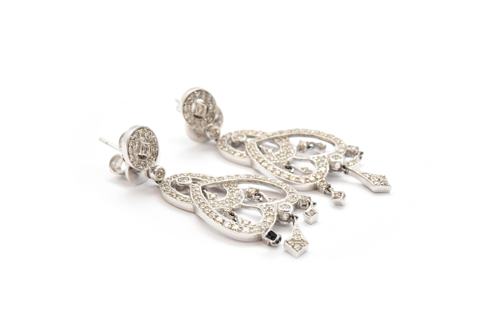 Designed in 18k white gold, these chandelier diamond earrings are the perfect way to show off your superior class. 1.75 carats of round brilliant diamonds are set into these gorgeous chandelier earrings! Six different parts of the earrings dangle by