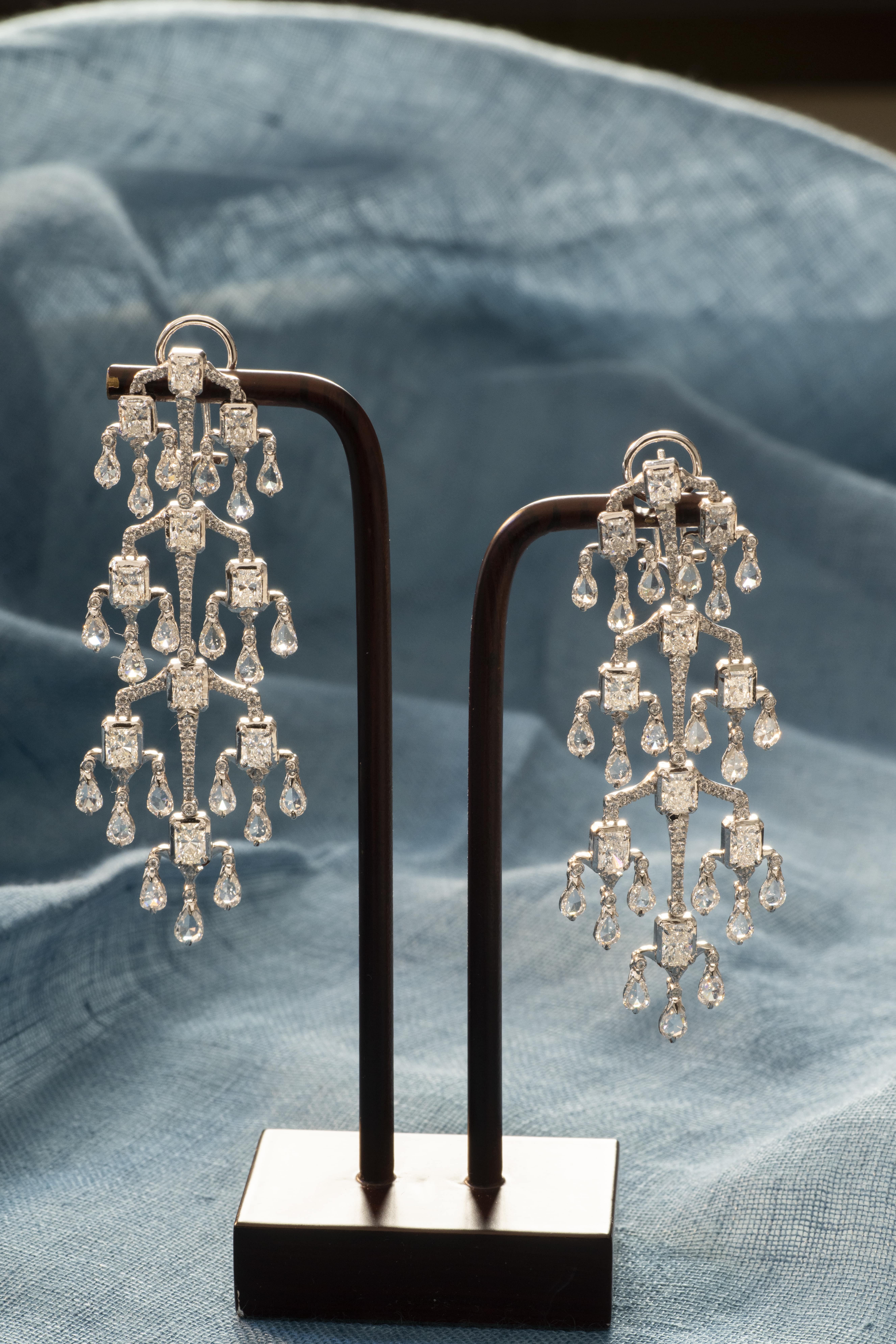 Stunning chandelier diamond earrings in 18 karat white gold with pear-shape, asscher-cut and round, brilliant-cut diamonds.

They say that chandeliers are the jewelry of architecture. Here, we have taken the iconic chandelier and transformed it into