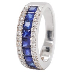 18 Karat White Gold Channel Set Princess Cut Blue Sapphire Diamond Band Ring