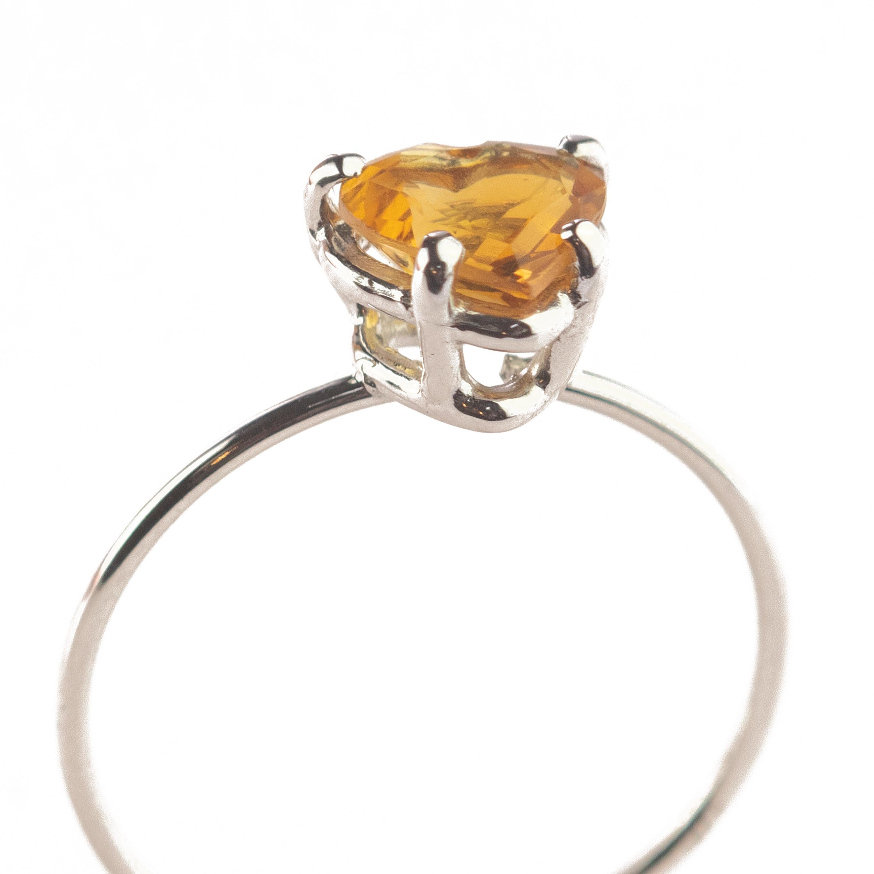 Marvelous handmade 18 karat white gold band thin ring embellished with a wonderful heart shaped citrine quartz. Open your intuition and enhance your senses to love. 

Inspired by strong feeling of love. The beating heart is used as an intensive form