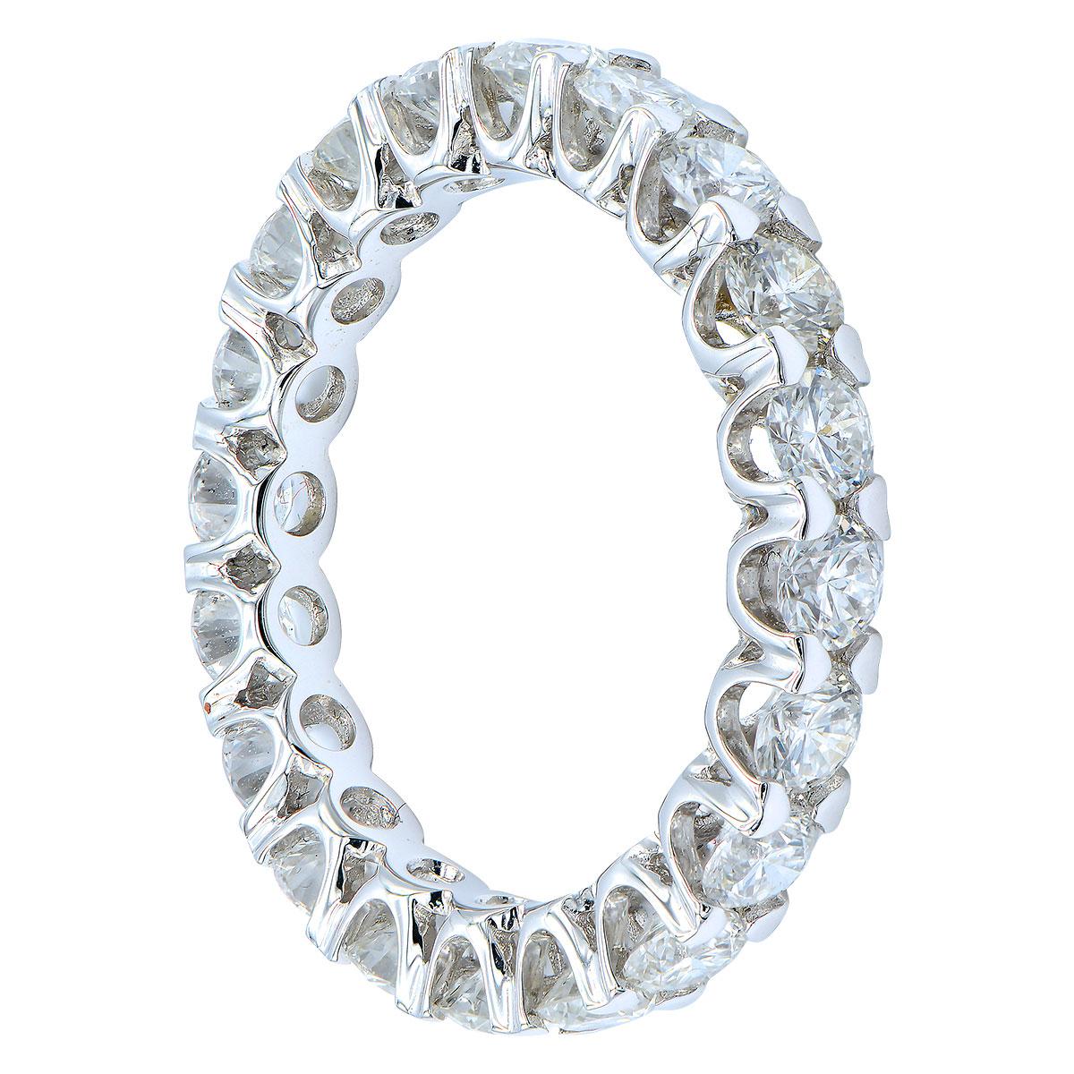 This gorgeous eternity band has 21 round VS2, G color diamonds that completely circle the band totaling 2.20 carats. The diamonds are set in 2.6 grams of 18 karat white gold with beautiful stylish prongs securing the diamond. This band is size 7.5.