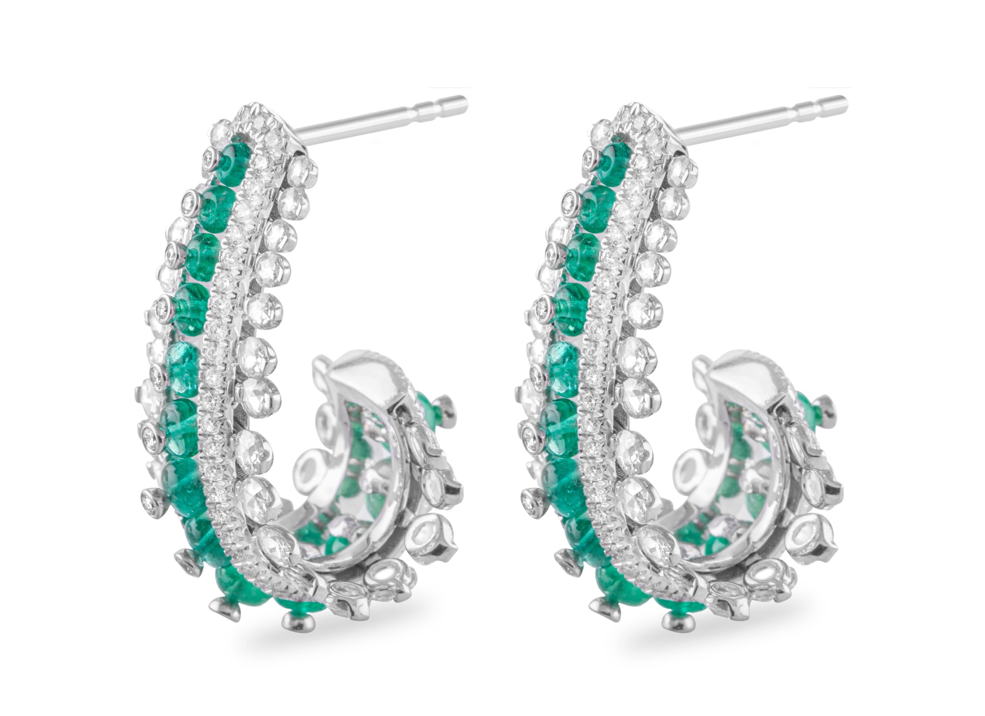 Columbian emeralds beads are delicately set in between two rows of rose-cut diamonds that appear to be suspended in mid-air in these gorgeous earrings in 18 karat white gold.

Columbian emeralds are an extremely sought-after variety of emerald