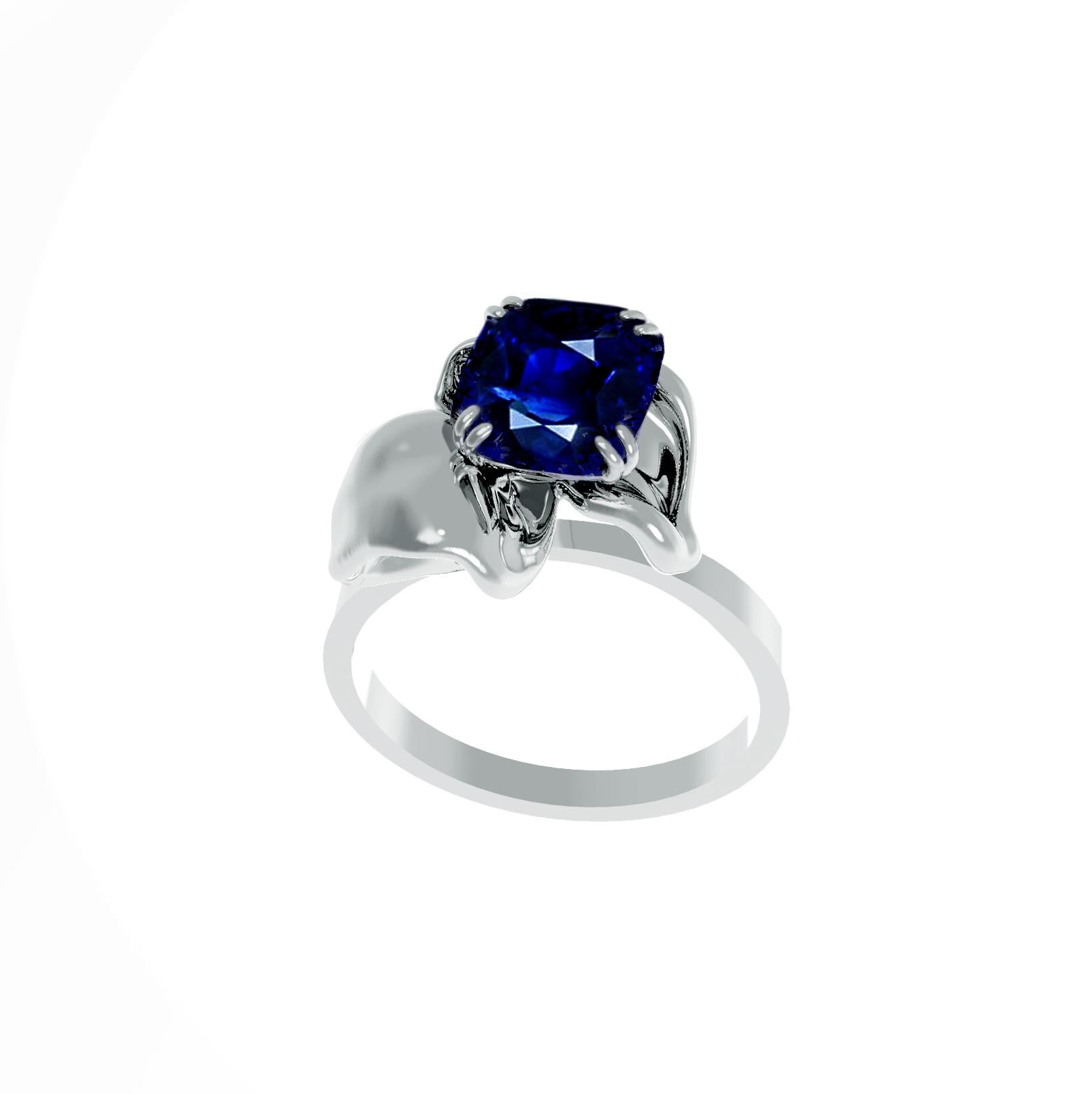 This contemporary cocktail ring is made of 18 karat white gold and is encrusted with a natural vivid blue 1,7 carats great cut transparent cushion sapphire. The ring's unique design features a tiny flower shape that visually enhances the size of the