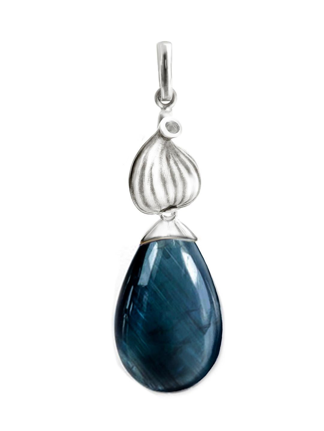 These contemporary drop earrings are made of 18 karat white gold with natural vivid Indicolite tourmalines (17.5x10.5x6 mm each, 18.7 carats in total) and round diamonds. The Fig collection was featured in Vogue UA review. They are designed by the