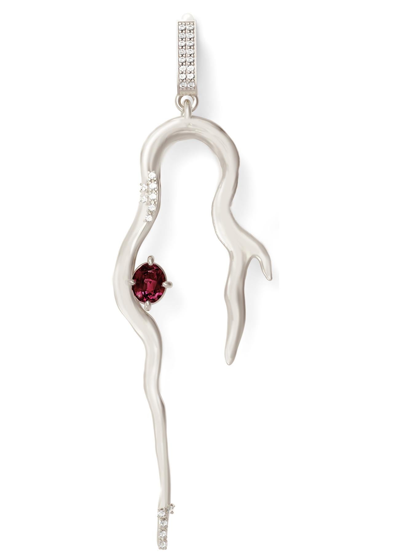 These contemporary 14 karat white gold cocktail earrings are encrusted with 56 natural round diamonds and wine red oval sapphire and matching Malaya garnet. Pine jewellery collection was featured in Vogue UA, Another UK, Interview, and other