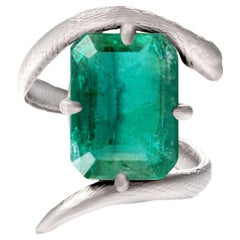 Eighteen Karat White Gold Contemporary Engagement Ring with Natural Emerald
