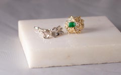 White Gold Contemporary Floral Emerald Engagement Ring with Seven Diamonds