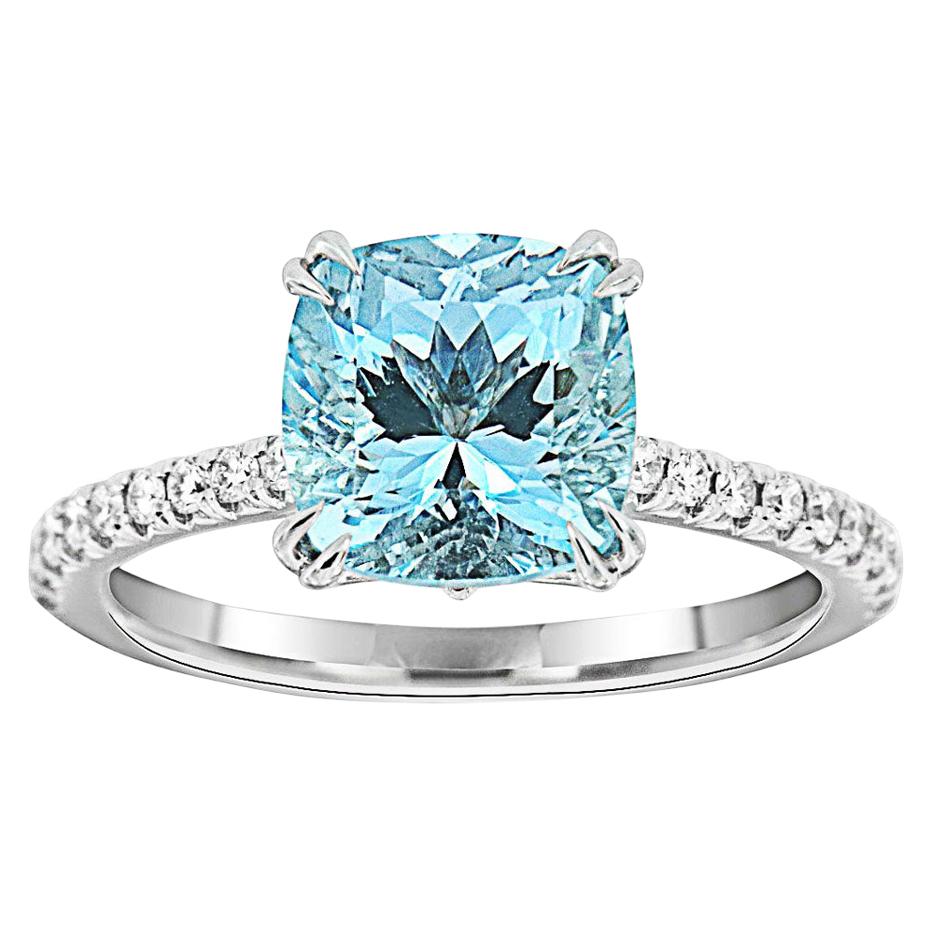 This classic ring features French Pave set diamonds in three-fourths of the band centering a 2.3-carat Cushion Aquamarine. Sky blue color. Twenty brilliant round diamonds in weight of 0.21 Carat. The ring is 1.8 MM wide and 1.75 MM thick. Experience