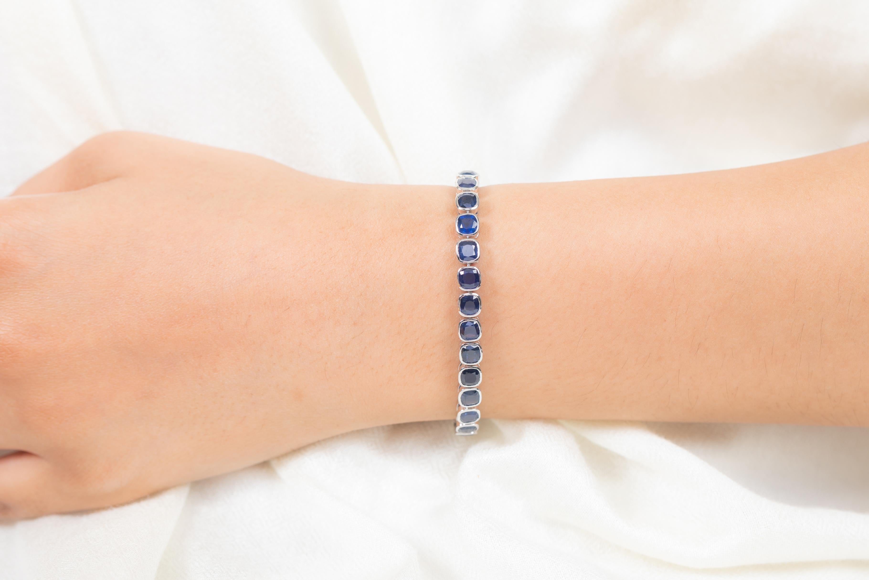 This Sapphire Tennis Bracelet Studded in 18K gold showcases 32 endlessly sparkling natural blue sapphire, weighing 19.15 carat. It measures 7 inches long in length. 
Sapphire stimulates concentration and reduces stress. 
Designed with perfect