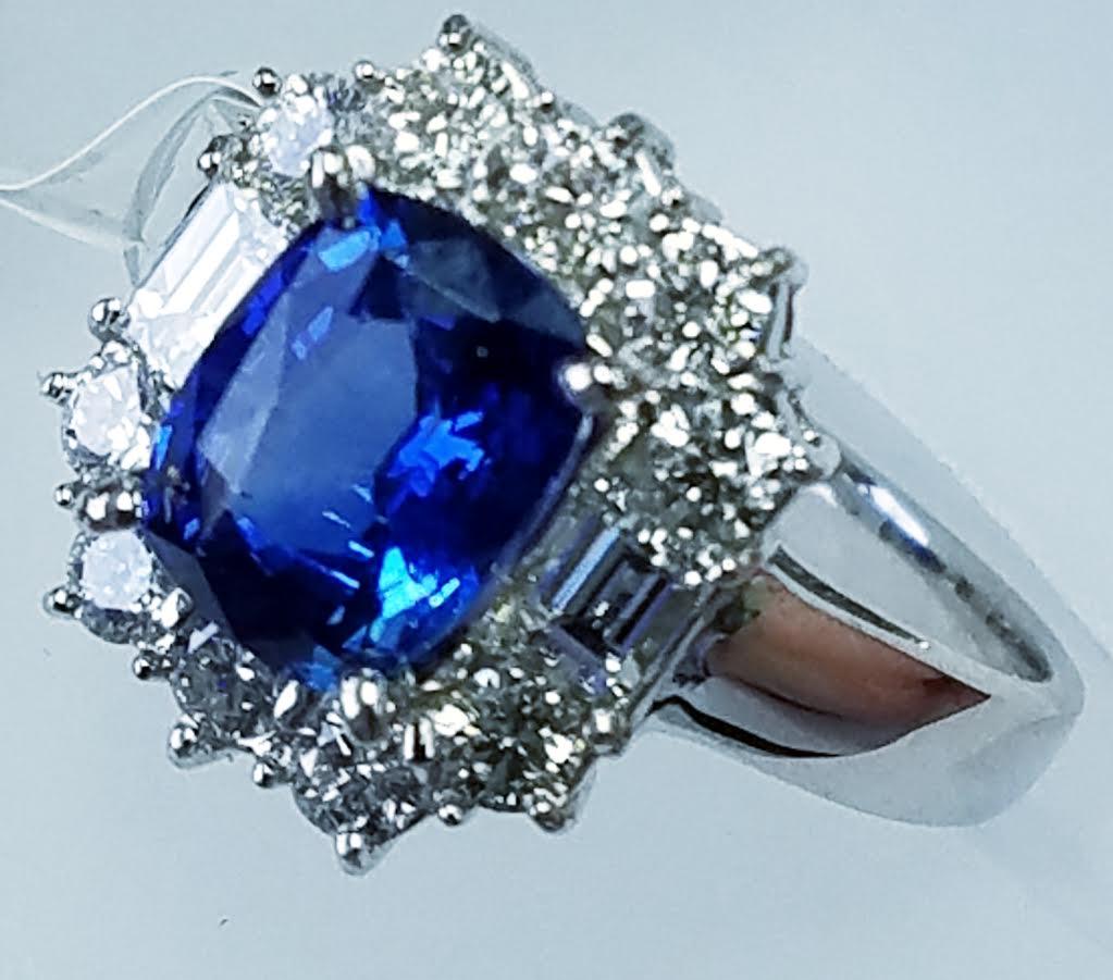 18 Karat White Gold Cushion Cut Blue Sapphire and Diamond Ring
1.83 Carats of Sapphires
0.82 Carats of Diamonds
Cushion Cut
18 Karat White Gold
