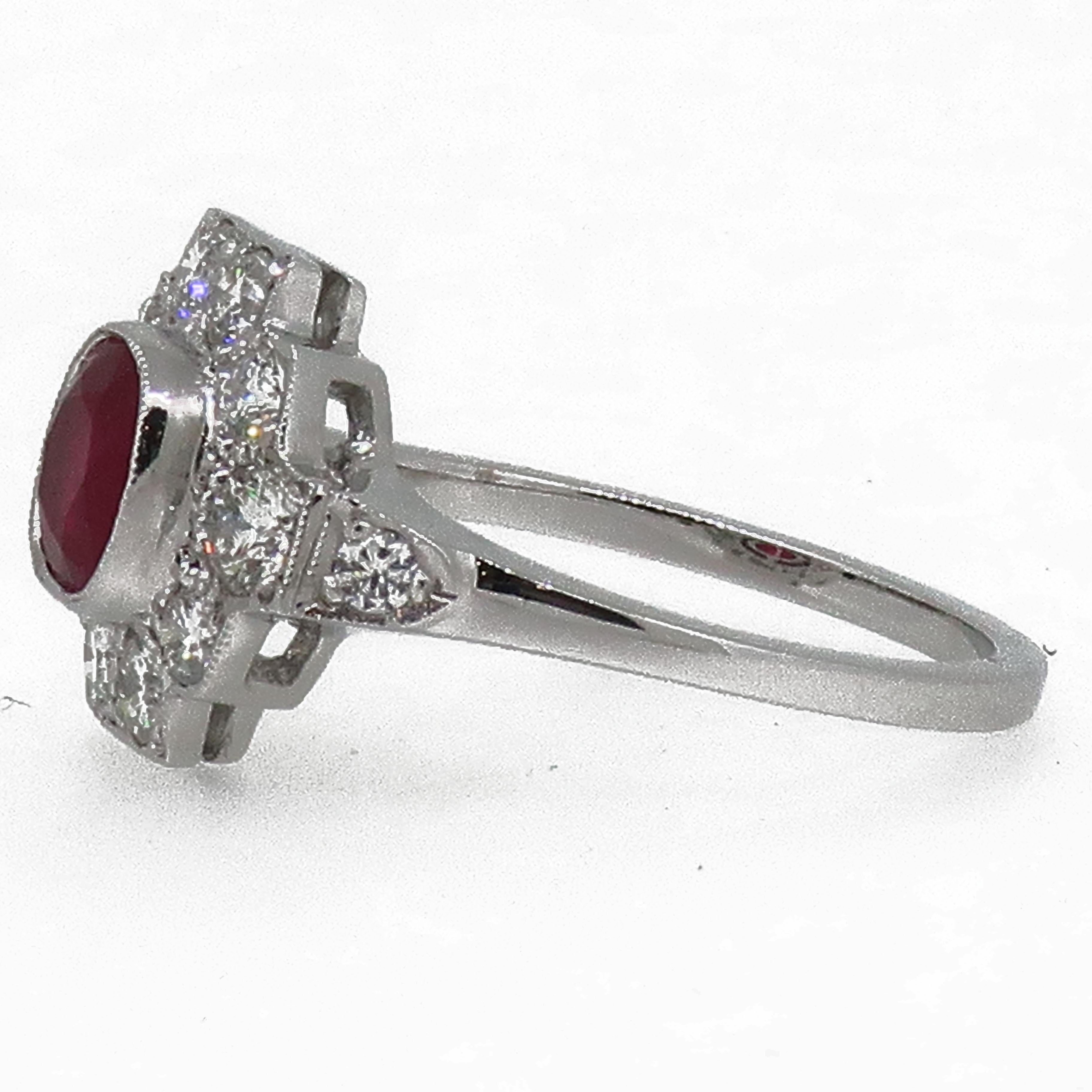 18 Karat Gold Cushion Cut Ruby & Diamond Art Deco Style Cluster Ring

An exquisite 1.03ct pigeon blood red cushion cut ruby ring. Central ruby is encased in a fine mill-grain bezel setting , surrounded by ten round brilliant cut diamonds, flowing on