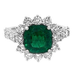 18 Karat White Gold Cushion Shaped 2.99 Carat Emerald 2.04 Carat Diamond Ring