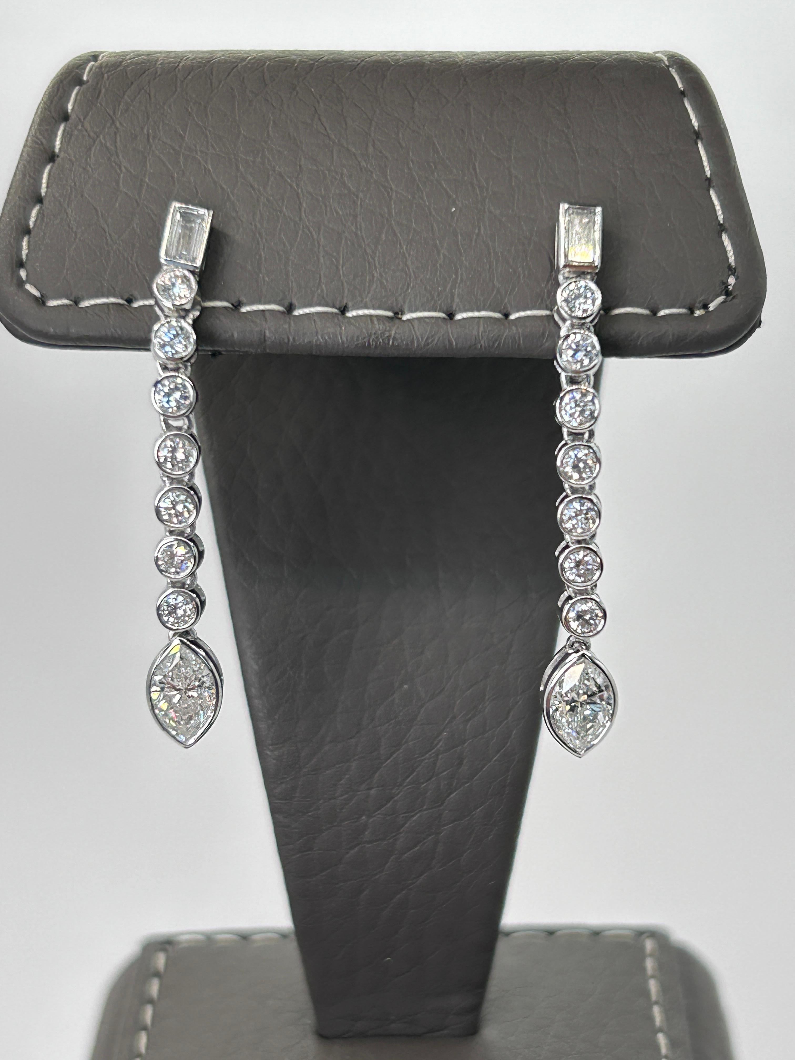 18 Karat White Gold Dangle Earrings, Bezel Set With Marquise Cut, Baguette Cut and Round Brilliant Cut Diamonds of 1.53 Carat Total Weight.
Beautiful Combination of Diamond Shapes to Your Elegant Earrings.