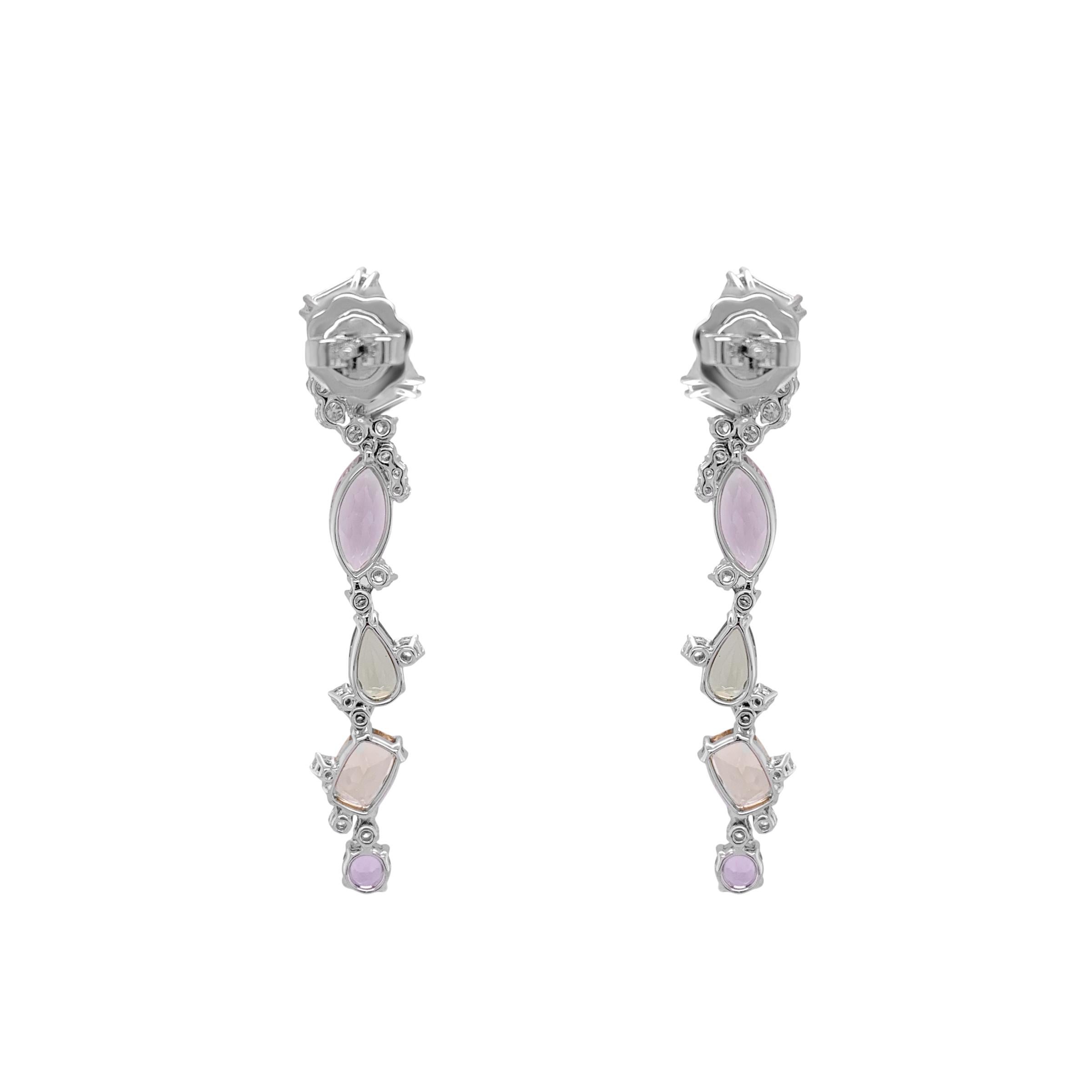 These colorful earrings are a whimsical fantasy in pastel tones, adorned with a sprinkle of white diamonds. They feature a mix of gemstones totaling 8.98 carats, including Aquamarine, Citrine, Amethyst, Pink and Green Tourmaline, complemented by