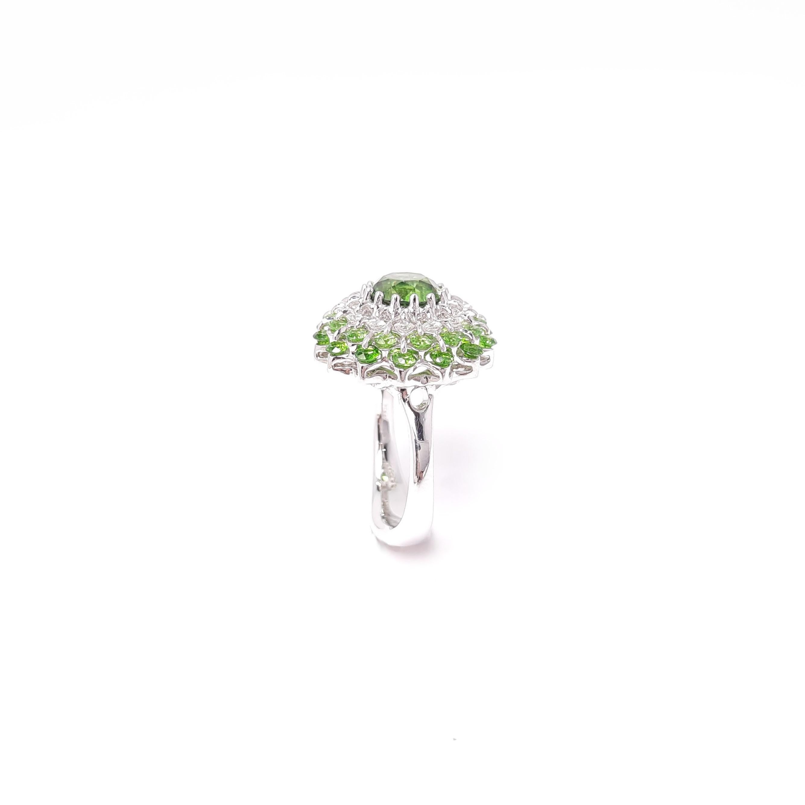 Russian Demantoid Garnets are mounted in the innovative diamond jewellery design inspired by famous ballet. 

Internationally patented, Waltzing Brilliance® technology is an innovative jewellery invention patented by a leading Russian designer,