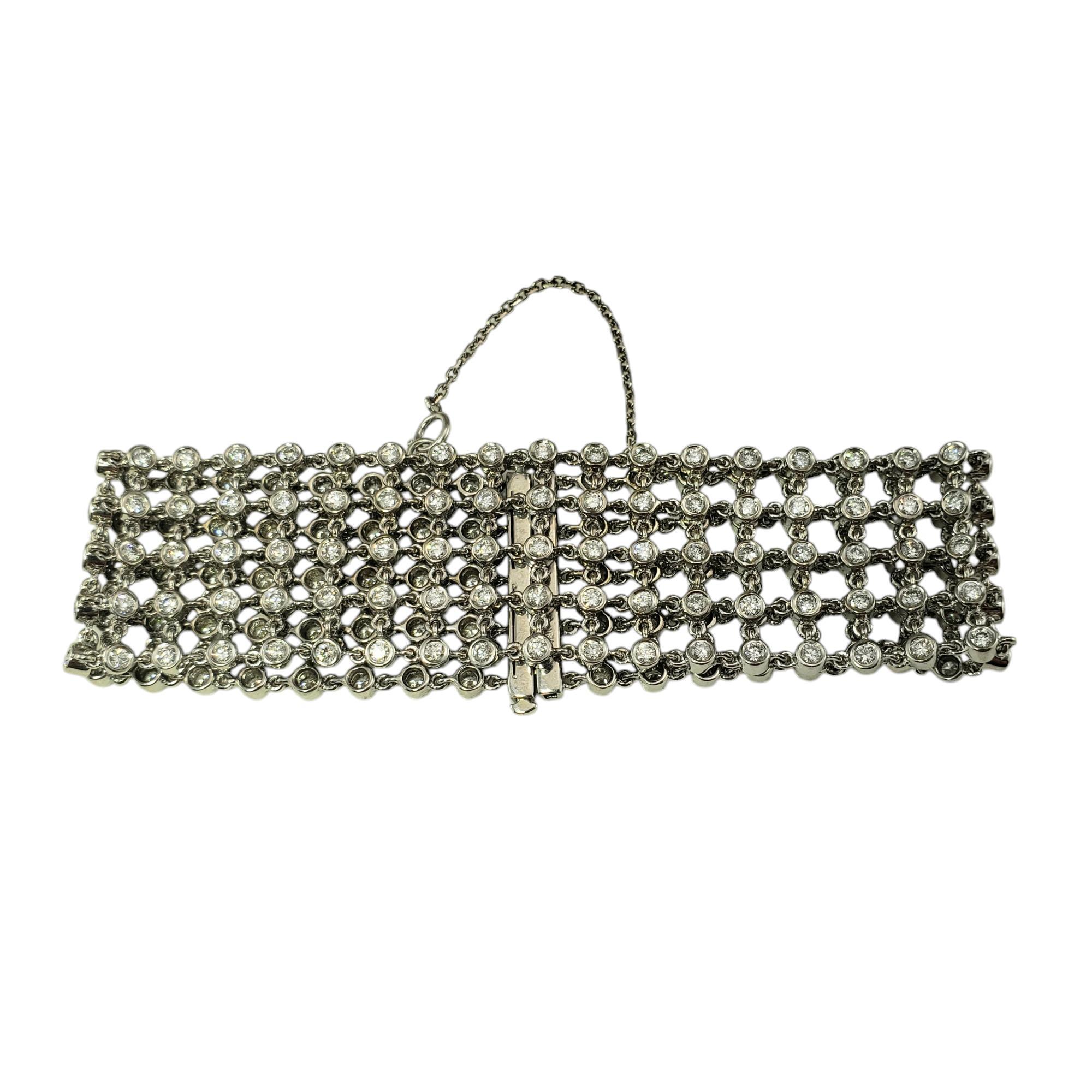18 Karat White Gold Diamond 5 Row Mesh Bracelet

This stunning flexible mesh bracelet features 199 white and 2 champagne  round brilliant cut diamonds set in 18K white gold.

Approximate total diamond weight: 5.50 -  6.0 carats

Diamond color: G -