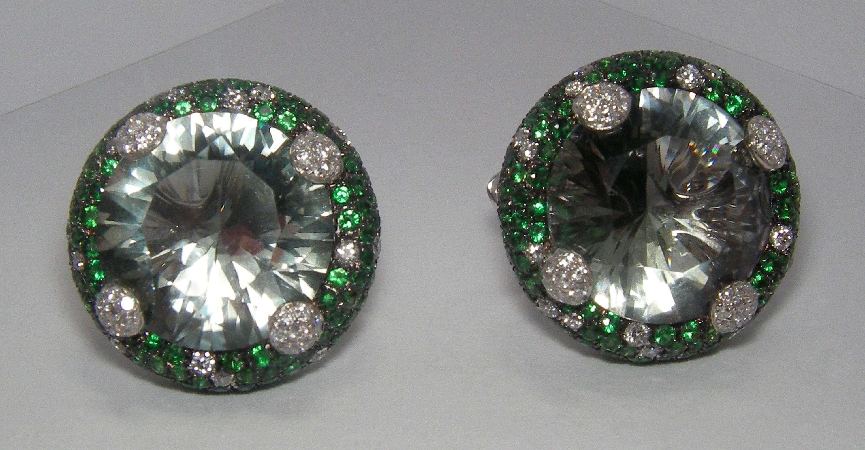 These 18 Karat White Gold earrings feature Diamonds and Tsavorite surrounding one round cut Amethyst center stone in each earring.
The vivid green is inspired by the Italian culture where the color is the definition hope while green Amethyst is to