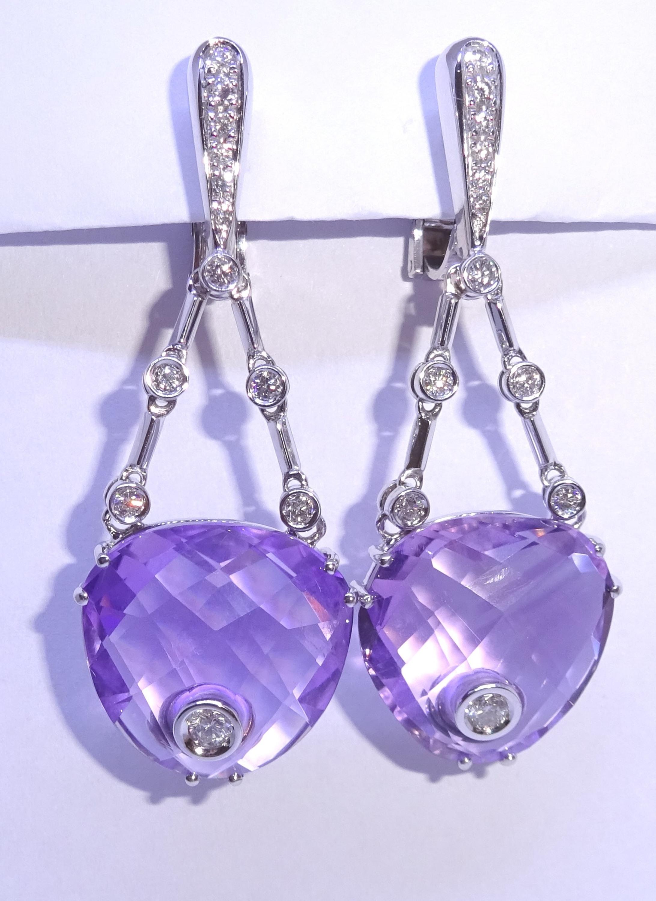 18 Karat White Gold Diamond and Amethyst Dangle Earrings


24 Diamonds 0.65 Carat
2 Amethyst 31.41 Carat



Founded in 1974, Gianni Lazzaro is a family-owned jewelery company based out of Düsseldorf, Germany.
Although rooted in Germany, Gianni