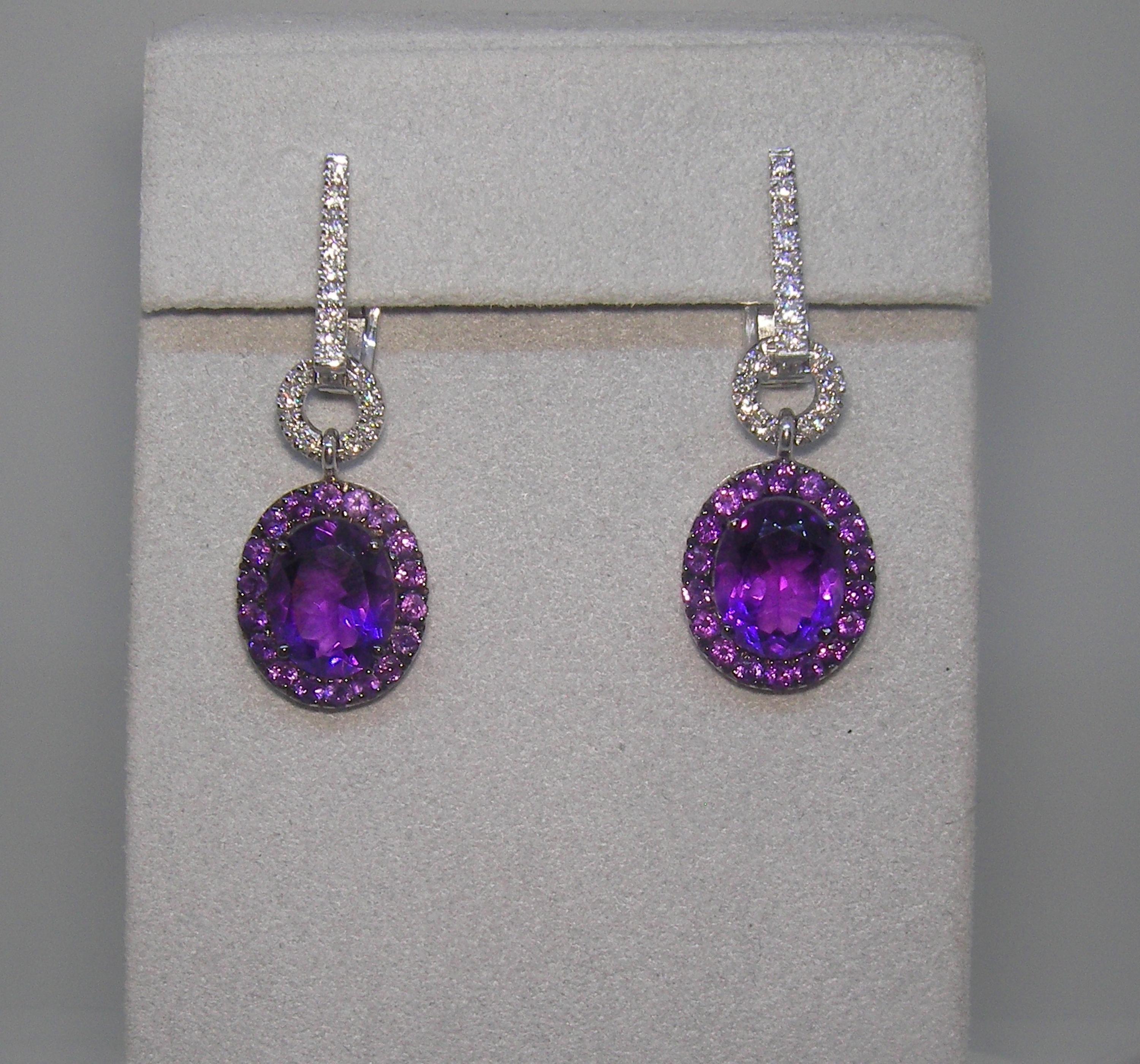18 Karat White Gold Diamond and Amethyst Dangel Earrings
32 Diamonds 0,38  Carat
2 Amethyst  16,55 Carat
36 Amethyst 1,26 Carat

Founded in 1974, Gianni Lazzaro is a family-owned jewelery company based out of Düsseldorf, Germany.
Although rooted in