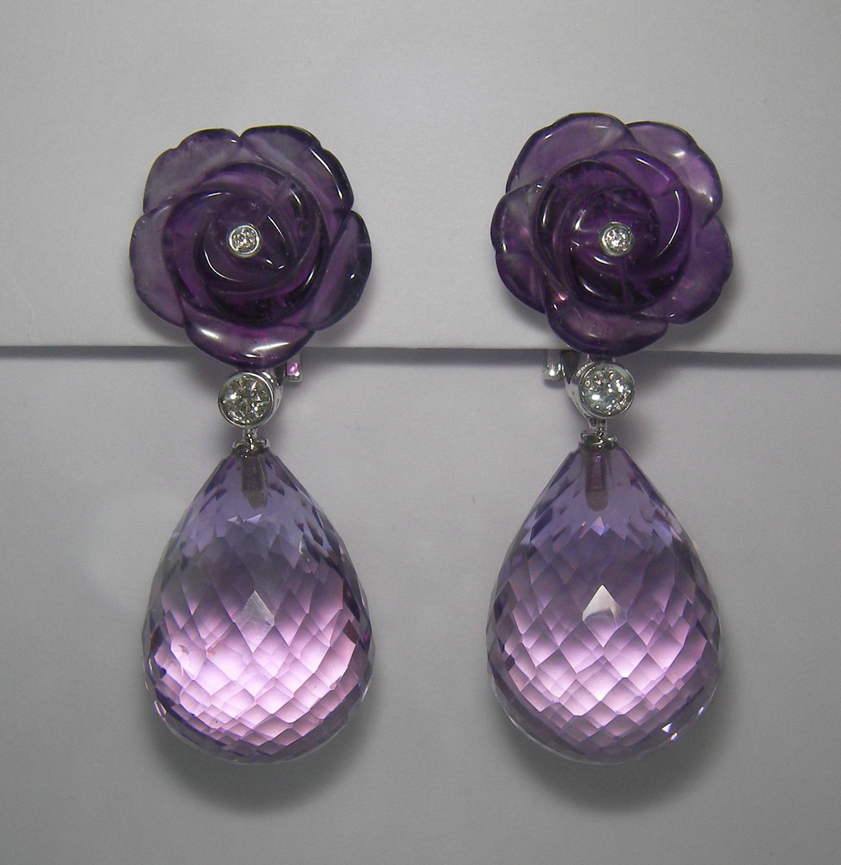 18 Karat White Gold Diamond and Amethyst Dangel Earrings
4 Diamonds 0.15  Carat
2 Amethyst Flower  13,61 Carat
2 Amethyst Briolet 57,04 Carat

Founded in 1974, Gianni Lazzaro is a family-owned jewelery company based out of Düsseldorf,