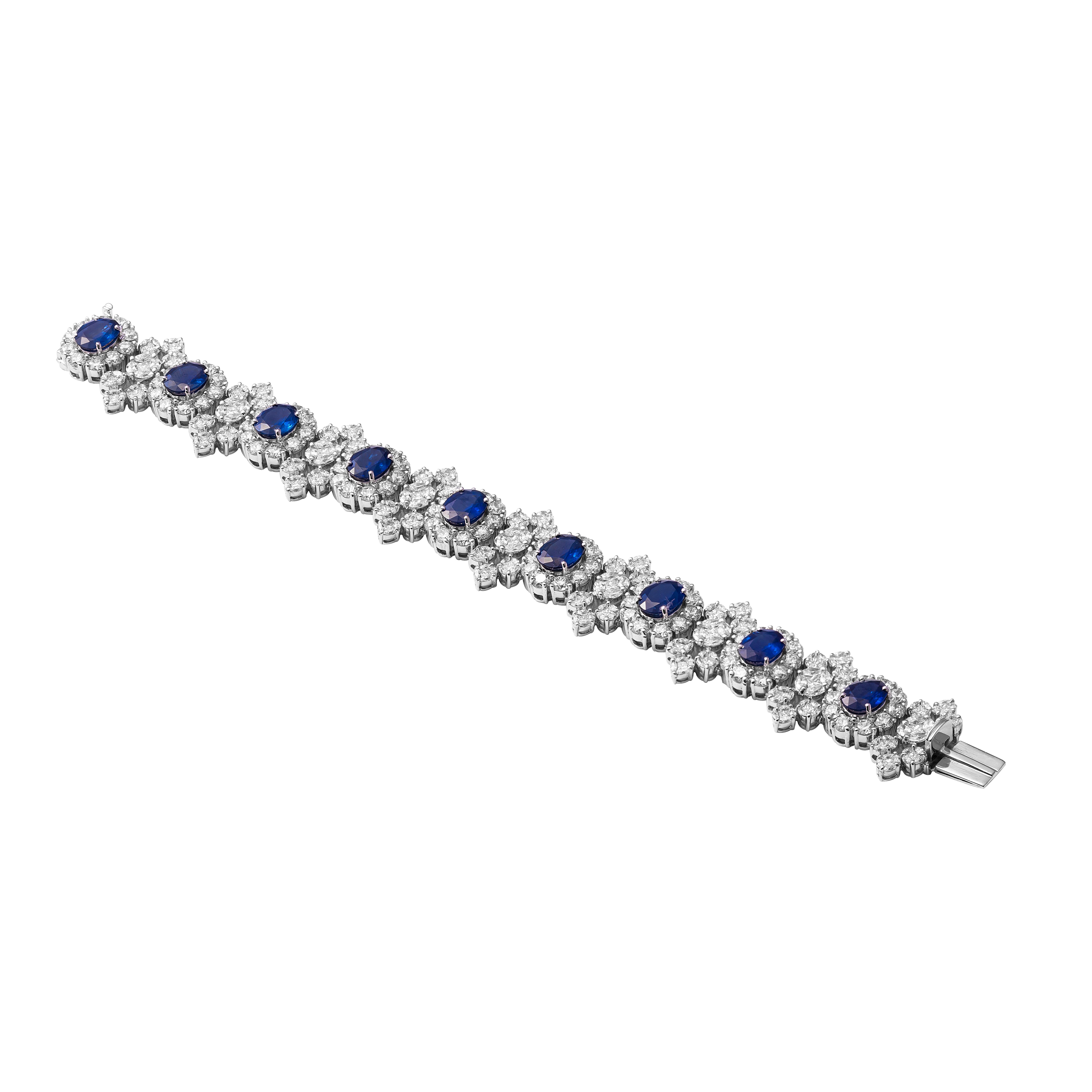 18 Karat White Gold Diamond And Blue Sapphire Bracelet

Beautifully crafted bracelet set in 18 karat white gold, studded with royal blue sapphires and VVS quality diamonds. 

18 Karat Gold - 52.396gms
Blue Sapphire - 17.48cts 
Diamonds - 21.79cts