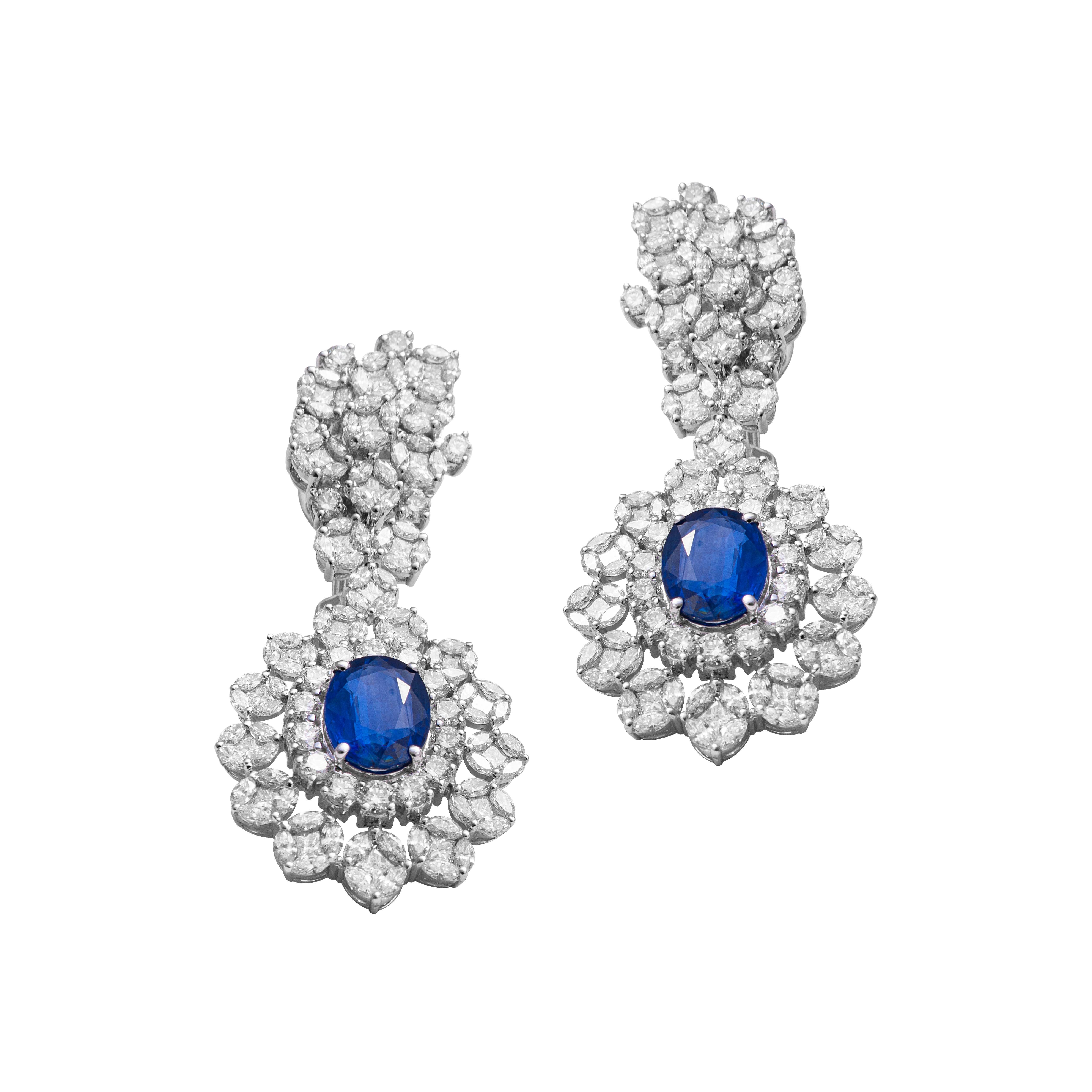 18 Karat White Gold Diamond And Blue Sapphire Bridal Necklace Set 

Beautifully crafted, this exquisite bridal necklace with earrings is set on 18 karat white gold and studded with VVS quality diamonds and royal blue sapphires. The opulence and