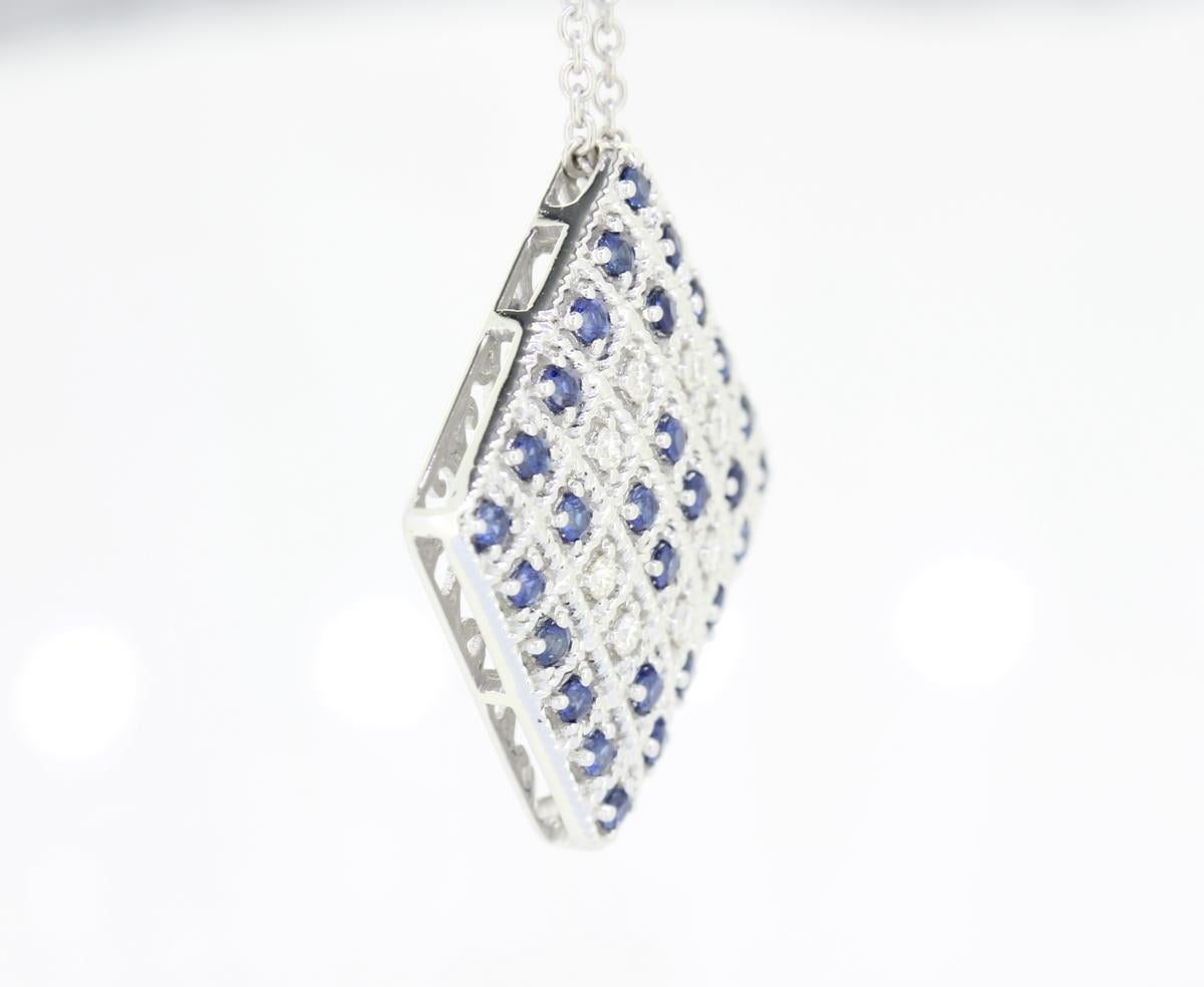 Round Cut 18 Karat White Gold Diamond and Blue Sapphire Necklace For Sale