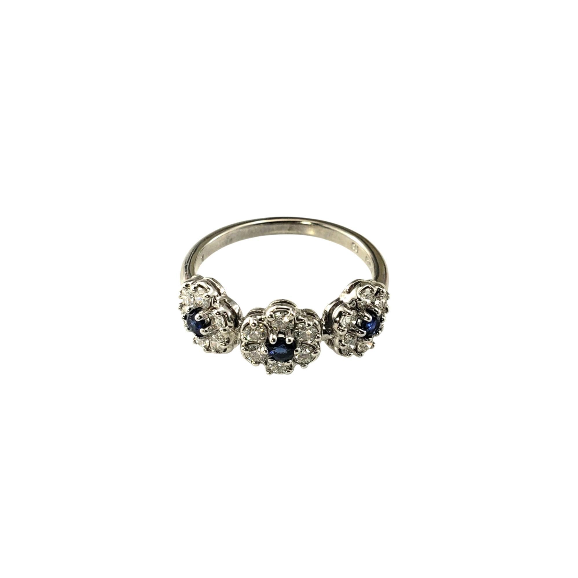 18K White Gold Diamond and Blue Stone Cluster Ring

Crafted in 18K white gold, this striking ring features 18 round diamonds arranged in three shimmering floral motifs. At the center of each cluster is a deep blue stone, adding a rich pop of color.