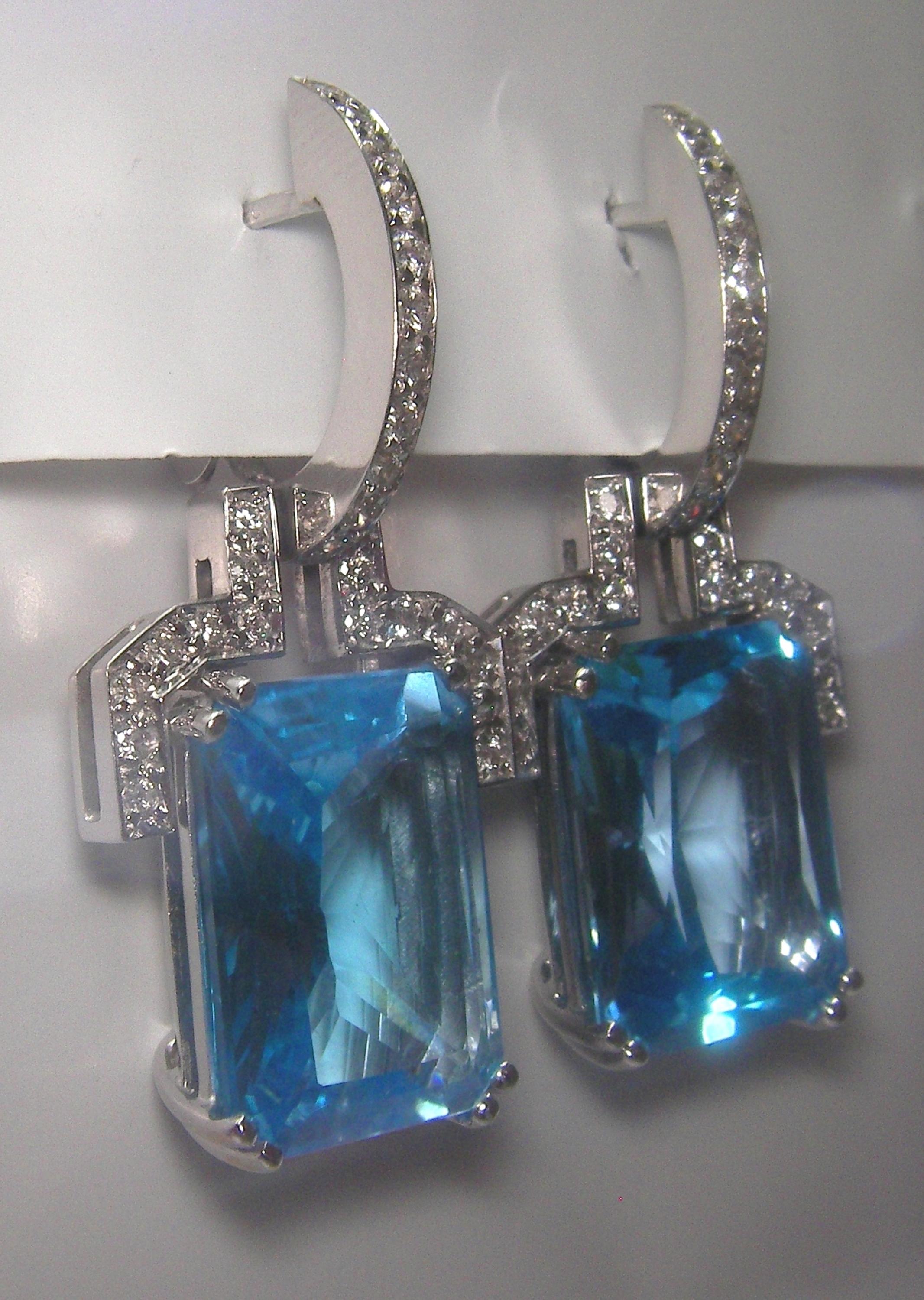 18 Karat White Gold Diamond and Blue Topaz Dangle Earrings

54 Diam. 0.65 Carat
2 Topaz 26,48 Carat
























34 Blue Topaz 17.36 Carats 
168 Diamonds 0.78 Carats


Founded in 1974, Gianni Lazzaro is a family-owned jewelery company