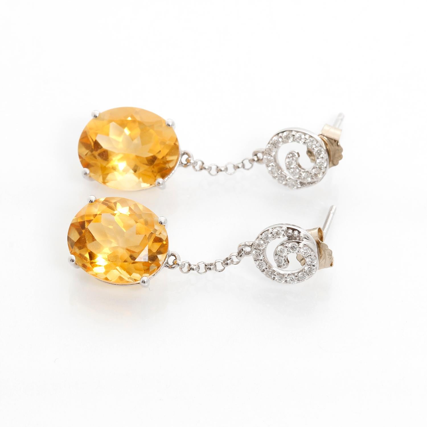 18K White Gold Diamond and Citrine Dangle Earrings  - Beautiful Citrine stones weighing approx. 3 cts. set on 18K White gold dangling from a spiral diamond set. Total weight 4.6 grams. Total length 1 inch.