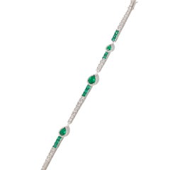 18 Karat white gold diamond and emerald bracelet