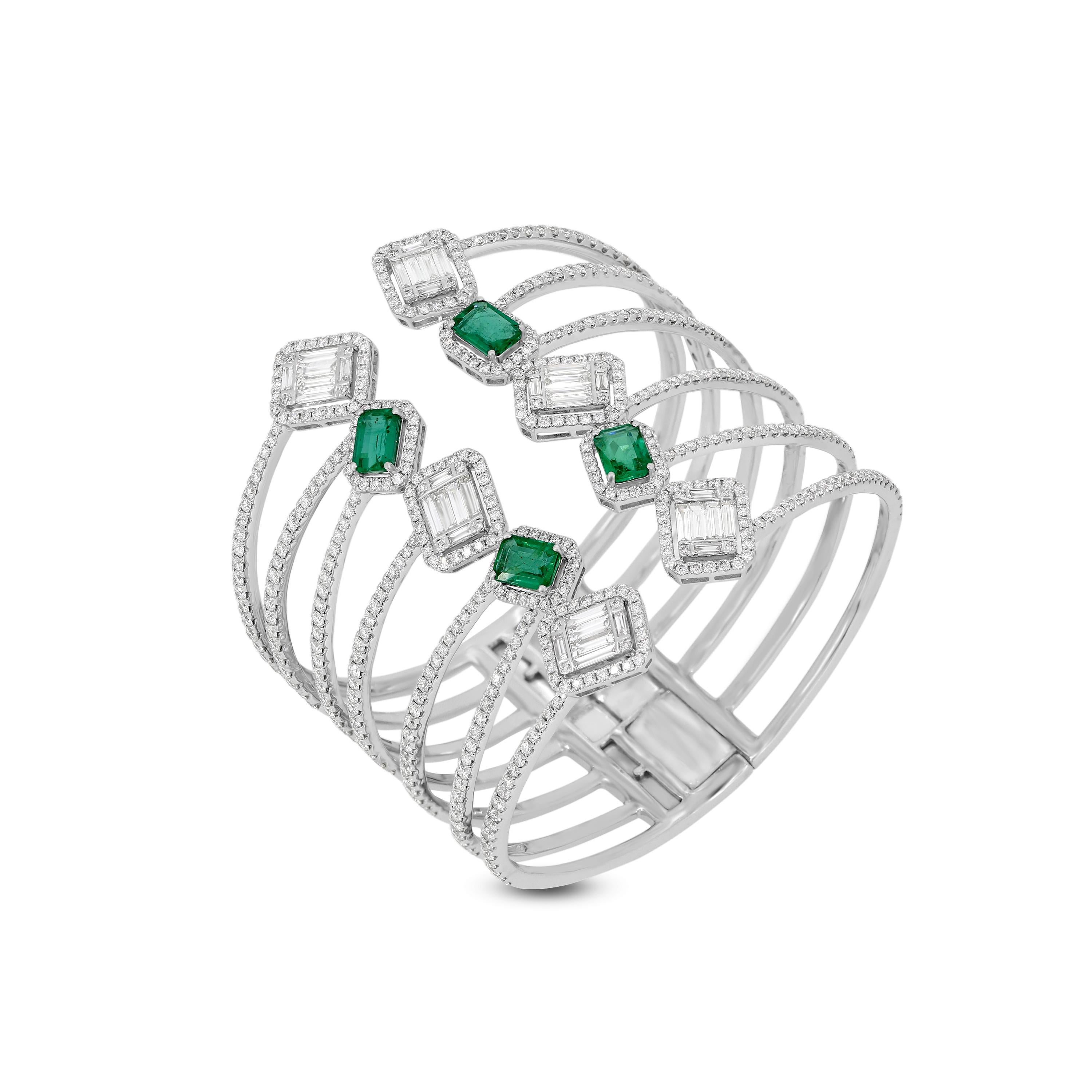 This glamorous cuff bangle in 18K white gold is a show stopper. Each bangle comes with over 10Cts of diamonds in varied shapes and 4 emeralds. The flexible design gives you the ability to wear in most hands.
JEWELRY SPECIFICATION:
Gross Weight: