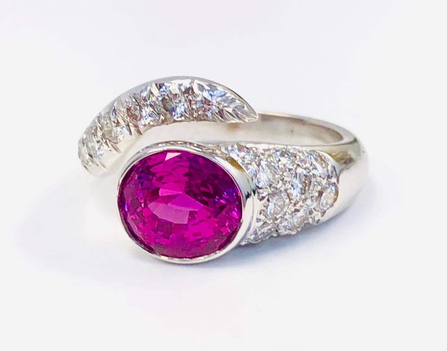 This modern twist Rind is made in 18 Karat White Gold, set with 19 fine Diamonds 0.74 carats and a gorgeous color Pink Sapphire 2.28 carats. This is the most Brilliant Pink Sapphire we have seen in a very long time!

We design and manufacture our