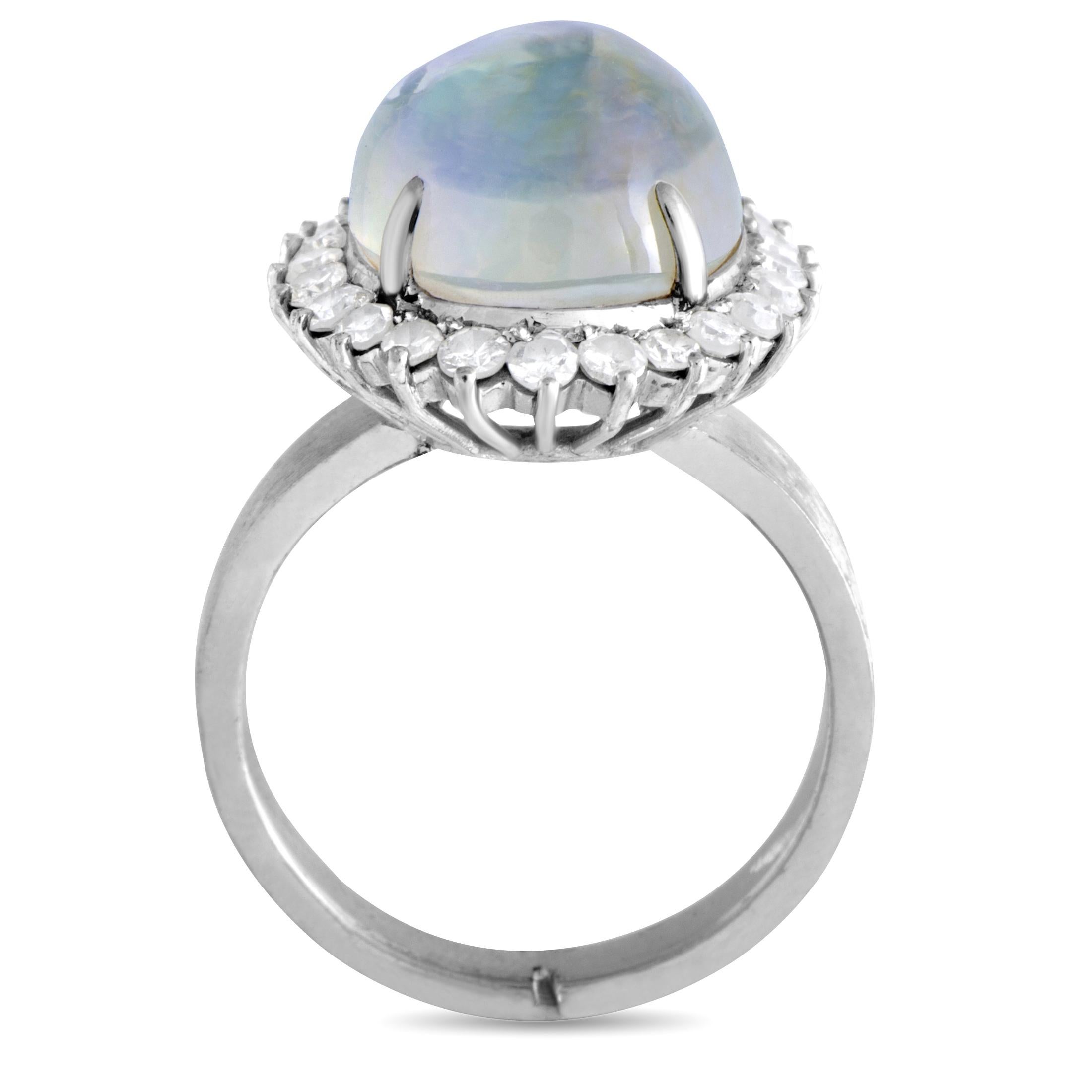 The fairytale-like beauty of the enticing opal is marvelously brought out by the scintillating brilliance of diamonds in this majestic 18K white gold ring. The diamonds amount to 0.65 carats, while the opal weighs 7.00 carats.
Ring Top Dimensions: