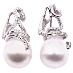 18 Karat White gold Diamond and Pearl Swirl Drop Earrings