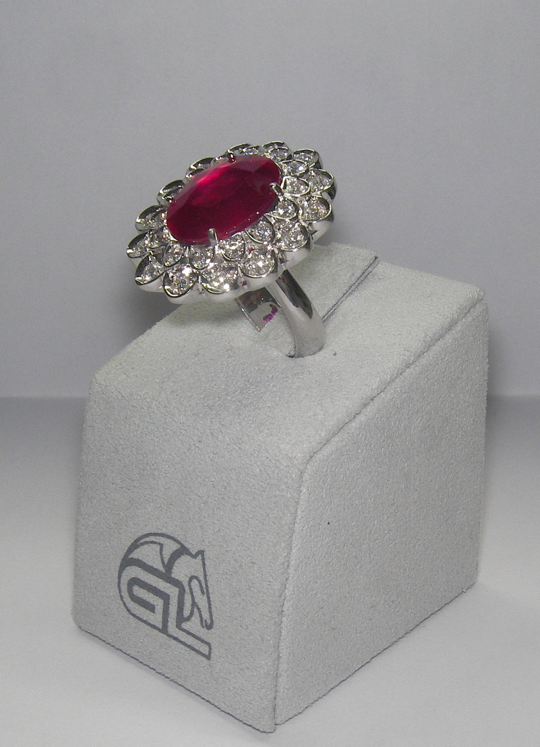18 Karat White Gold Diamond and  Ruby Glass felt  Coktail Ring

28 Diam. 1,09 Carat
1  Ruby 9,58 Carat

Size 51 US 5






















34 Blue Topaz 17.36 Carats 
168 Diamonds 0.78 Carats


Founded in 1974, Gianni Lazzaro is a family-owned