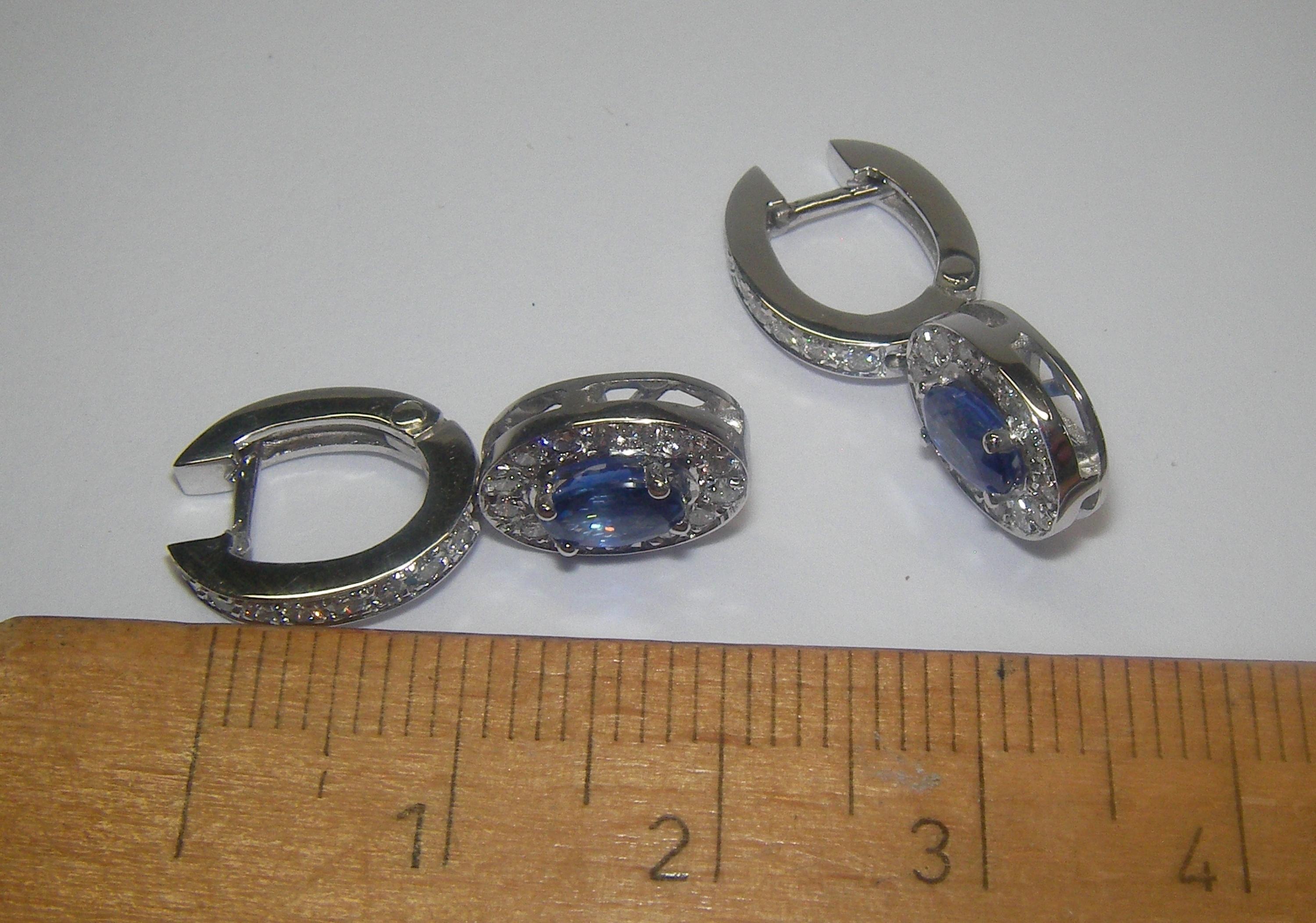 Oval Cut 18 Karat White Gold Diamond and Sapphire Dangle Earrings For Sale