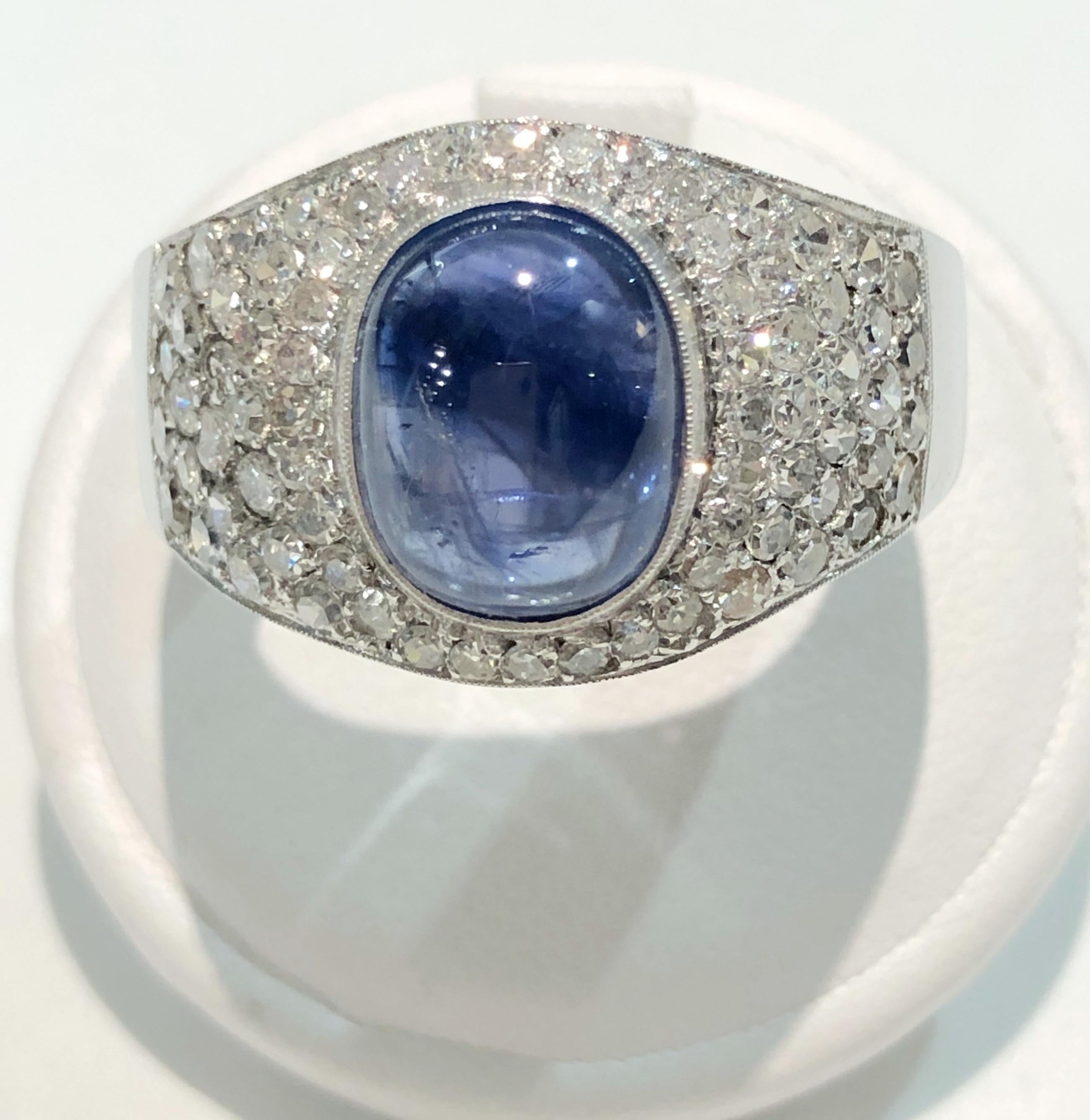 Vintage Pavé ring with 18 karat white gold band, one center cabochon sapphire of 3 karats, and brilliant diamonds for a total of 0.5 karats, Italy 1930s-1940s
Ring size US 9