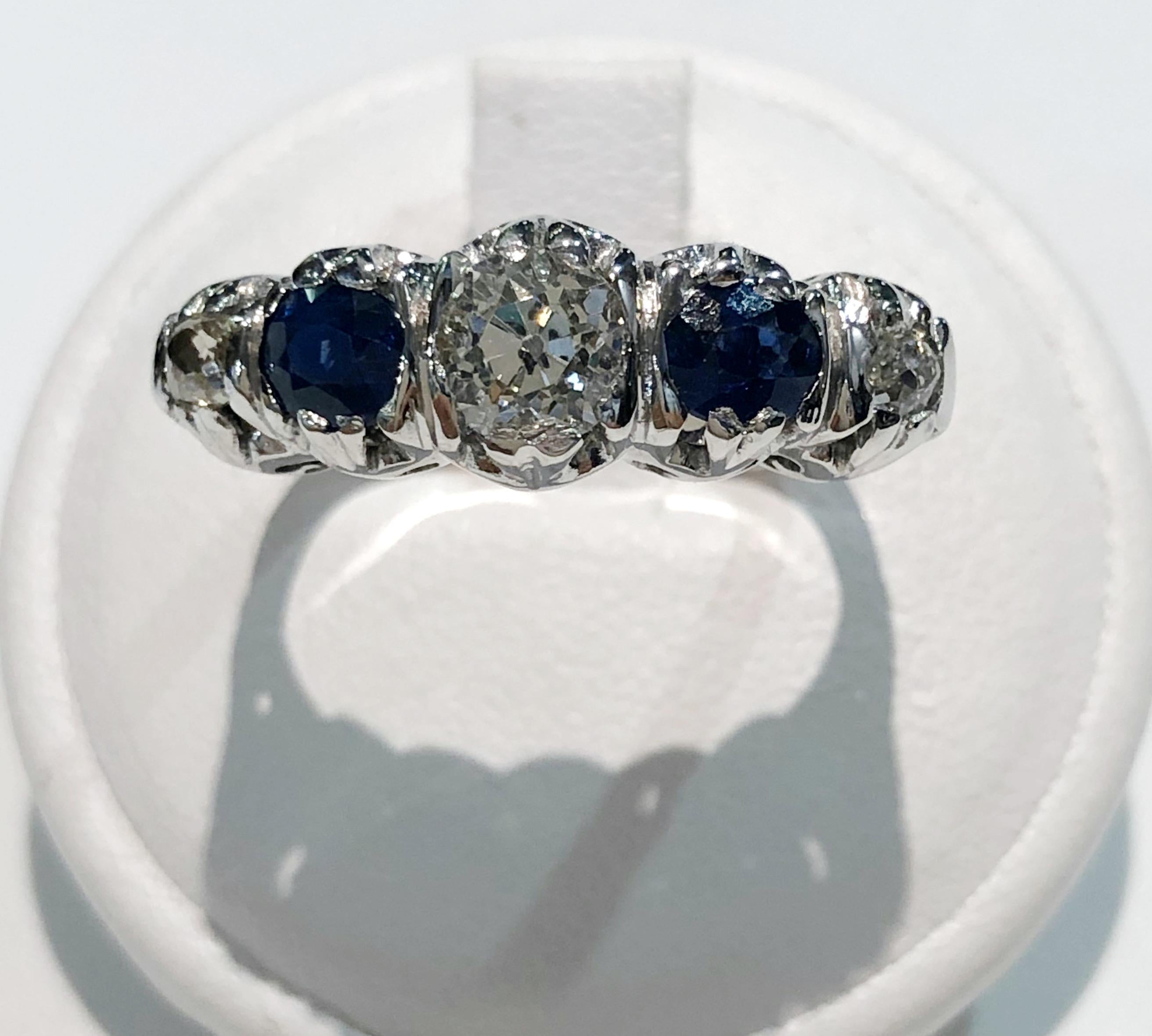 Vintage ring with 18 karat white gold band, two sapphires for a total of 0.8 karats and three brilliant diamonds for a total of 0.7 karats, Italy 1930s
Ring size US 7