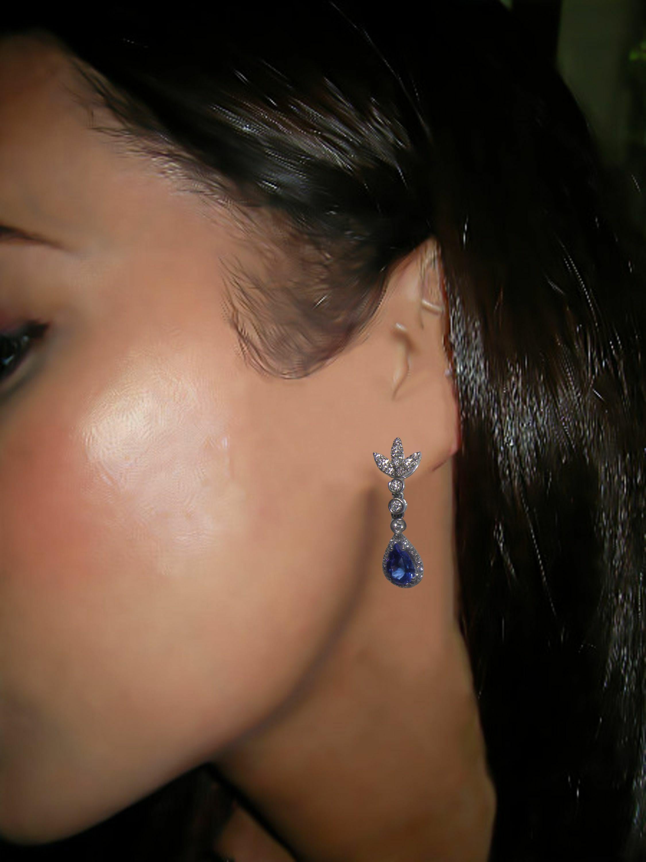 white gold tanzanite white zircon and diamond dangle earrings