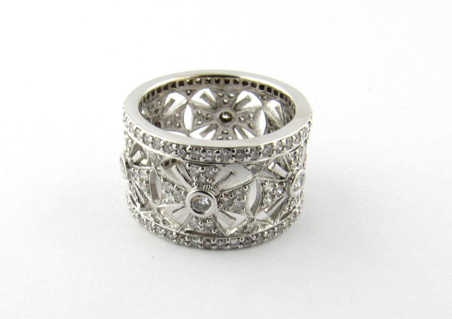 Vintage 18 Karat White Gold Diamond Band Size 6.5

This stunning band features 134 round brilliant cut diamonds set in beautifully detailed 18K white gold. 

Band width 12 mm. 

Approximate diamond weight: 1.70 cts. 

Diamond clarity: SI-I1
