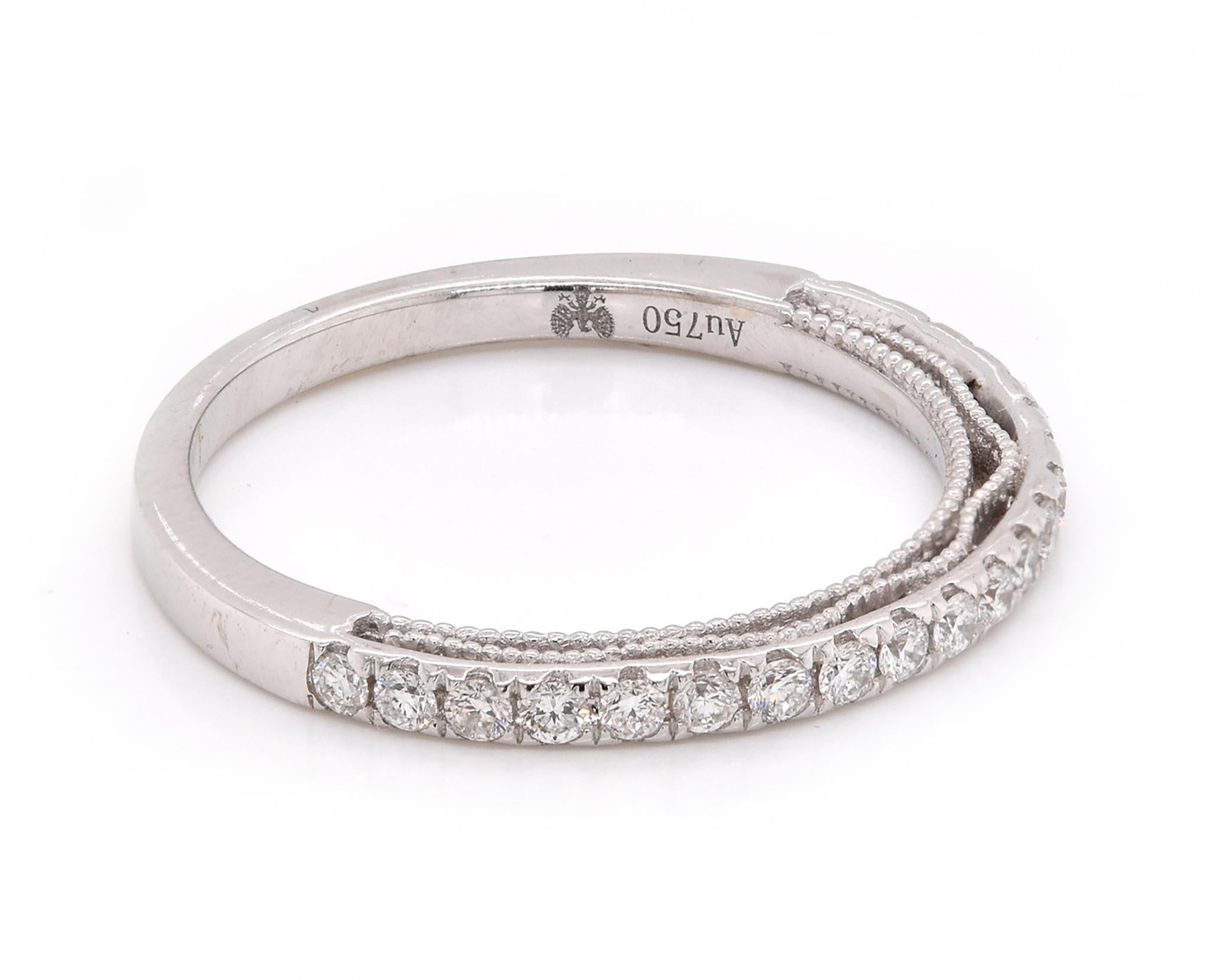 Designer: Custom
Material: 18K white gold
Diamonds: 21 round cut = .52cttw
Color: G
Clarity: VS
Size: 7
Dimensions: ring measures 1.8mm in width
Weight: 2.39 grams
