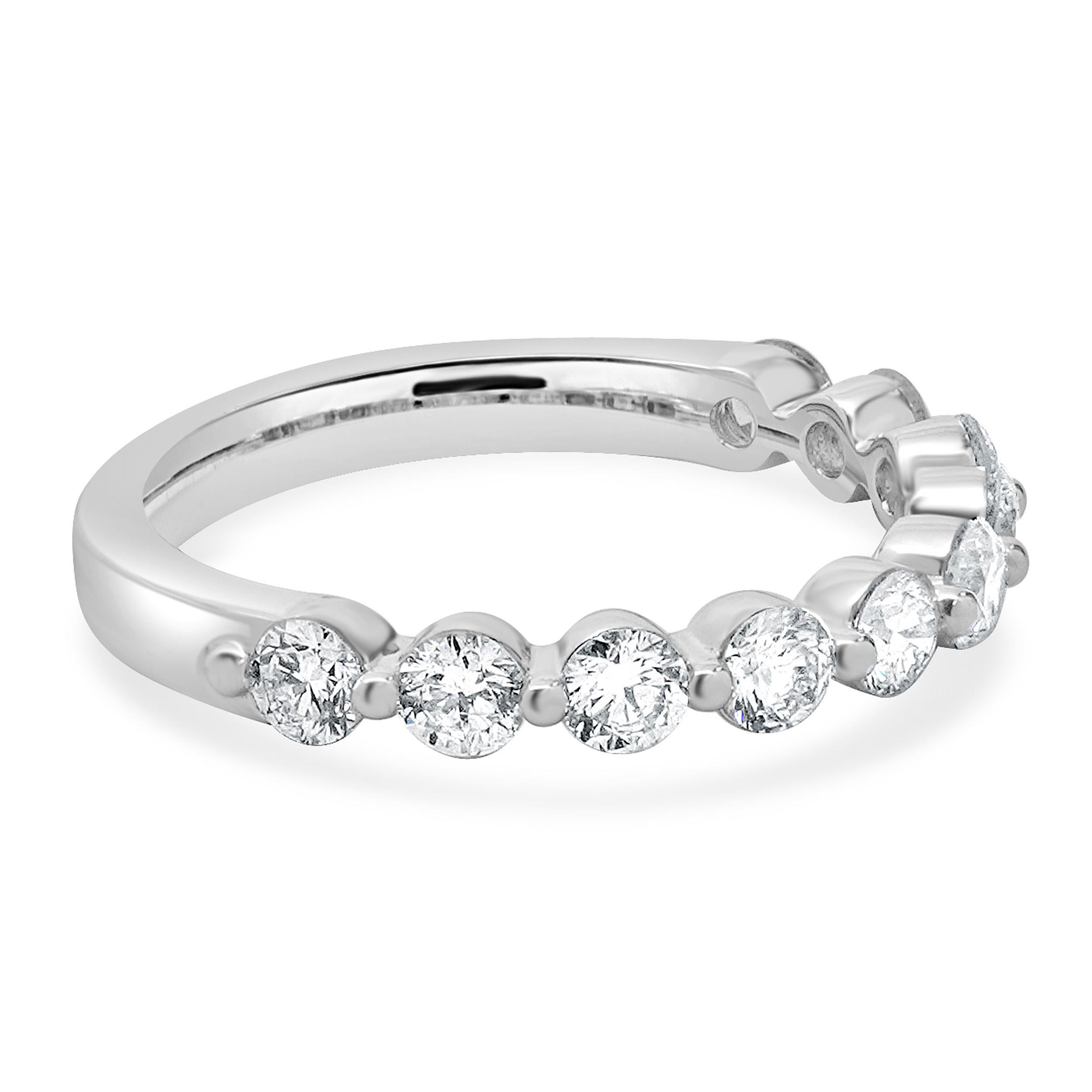 Designer: custom
Material: 18K white gold
Diamond: 10 round brilliant cut = 0.93cttw
Color: G
Clarity: VS2
Ring size: 6.5 (please allow two additional shipping days for sizing requests)
Weight: 3.28 grams
