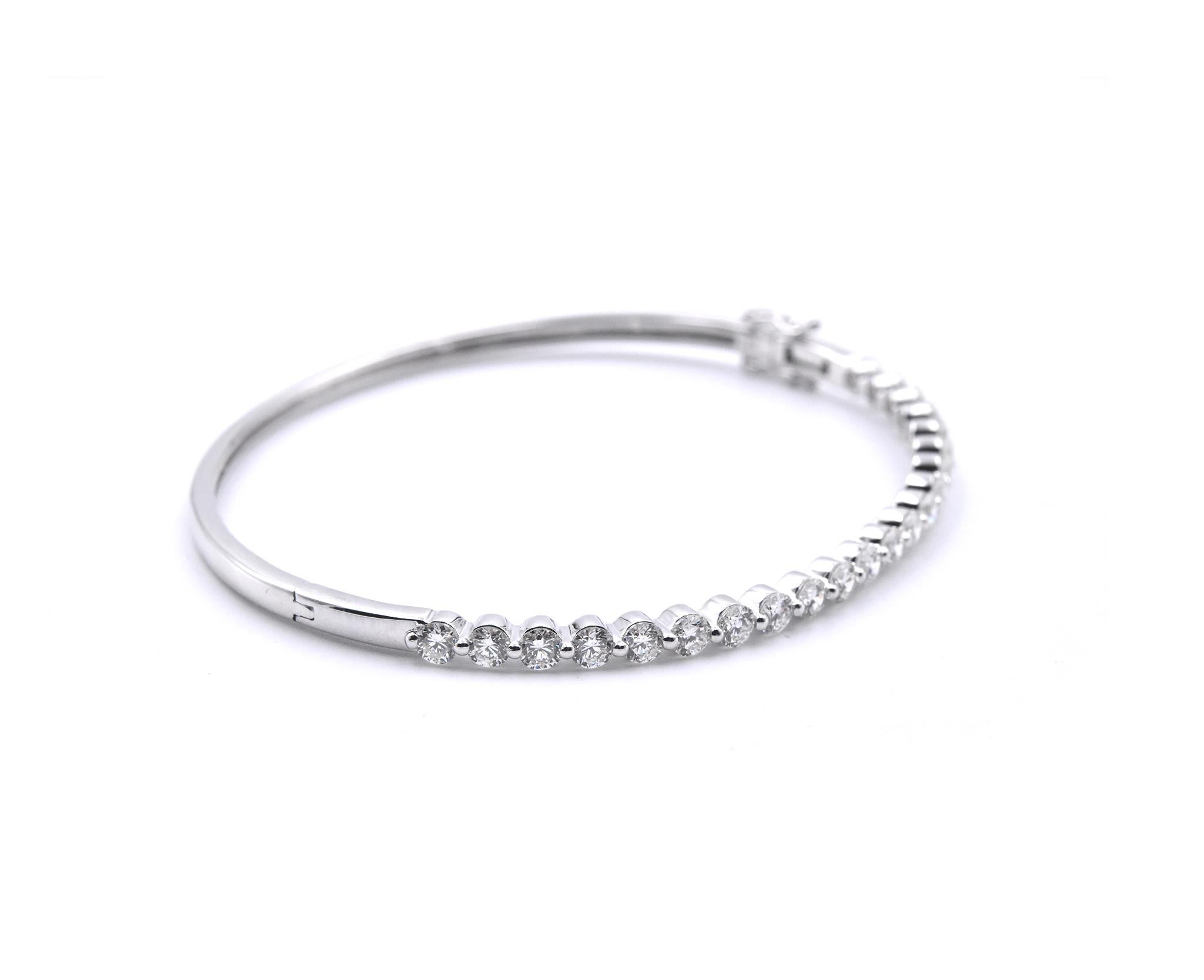 Material: 18K White Gold
Diamonds:  22 Round brilliant cuts = 2.20cttw
Color: G
Clarity: VS
Dimensions: bracelet measures 6.5-inches in length
Weight: 5.90grams
