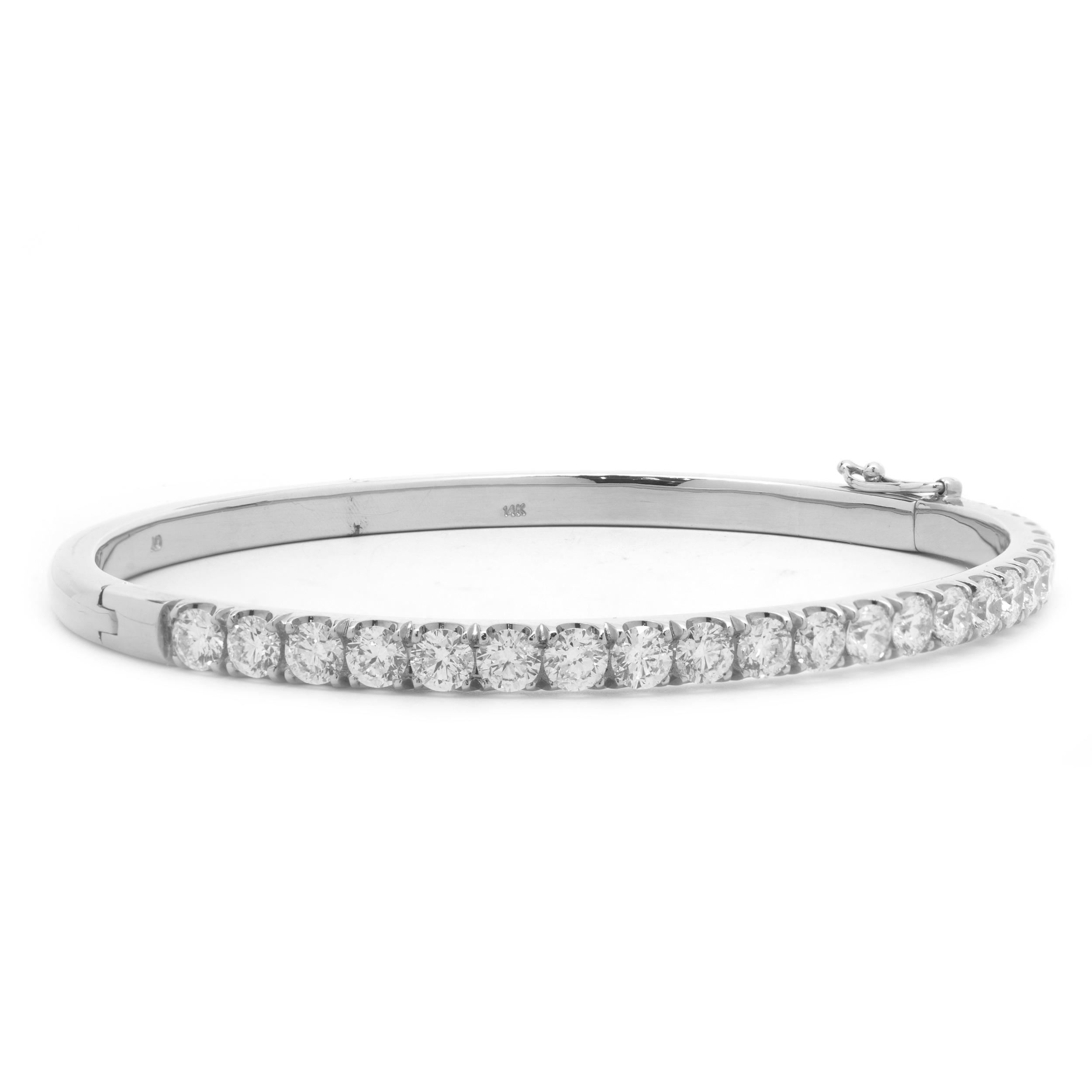 Material: 18K white gold
Diamonds: 21 round brilliant cut = 4.20cttw
Color: G
Clarity: VS2-SI1
Dimensions: bracelet will fit up to a 6.5-inch wrist
Weight: 17.21 grams
