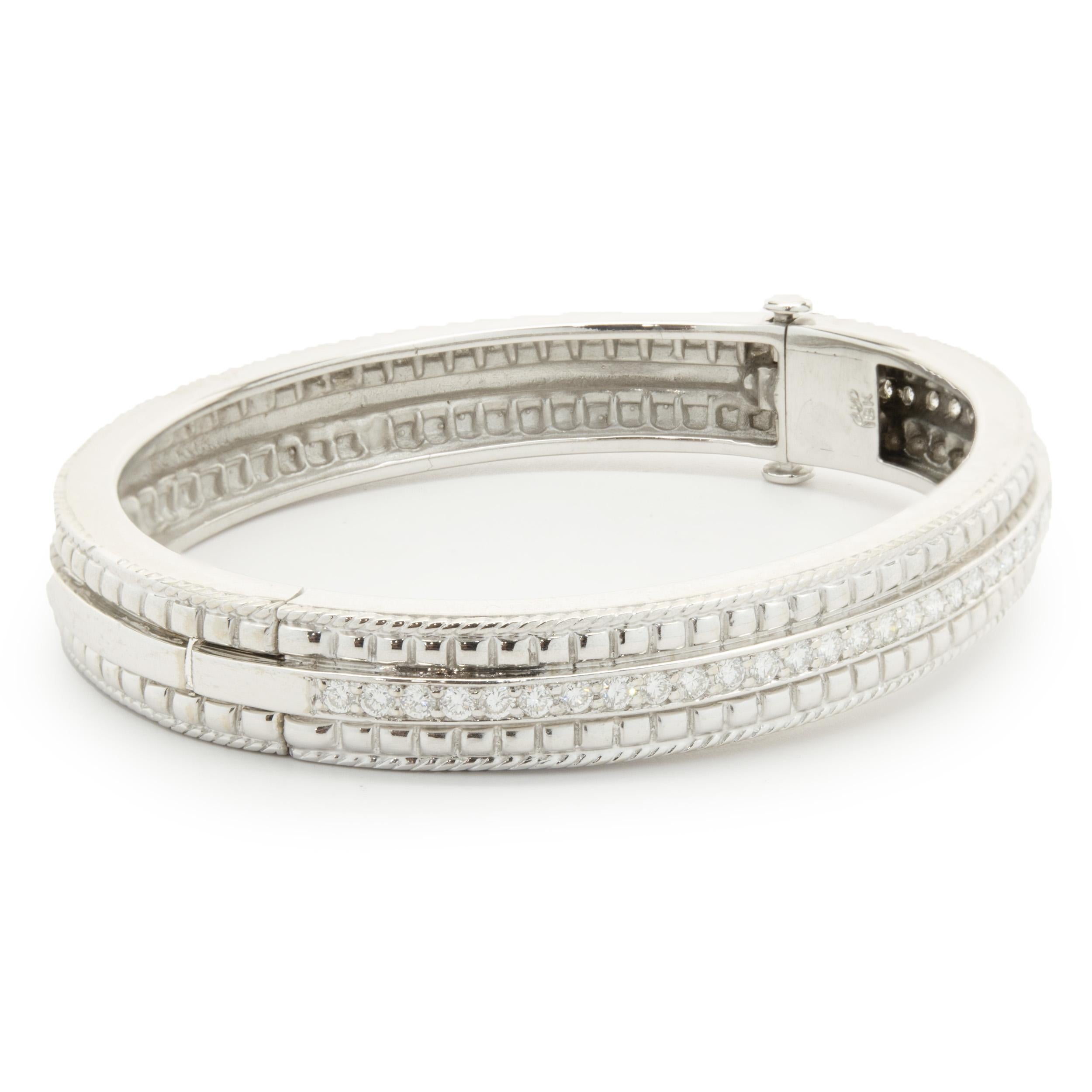 Designer: custom design
Material: 18K white gold
Diamonds: 40 round brilliant cut = 1.20cttw
Color: G
Clarity: VS2
Dimensions: bracelet will fit up to a 7 -inch wrist
Weight: 34.80 grams